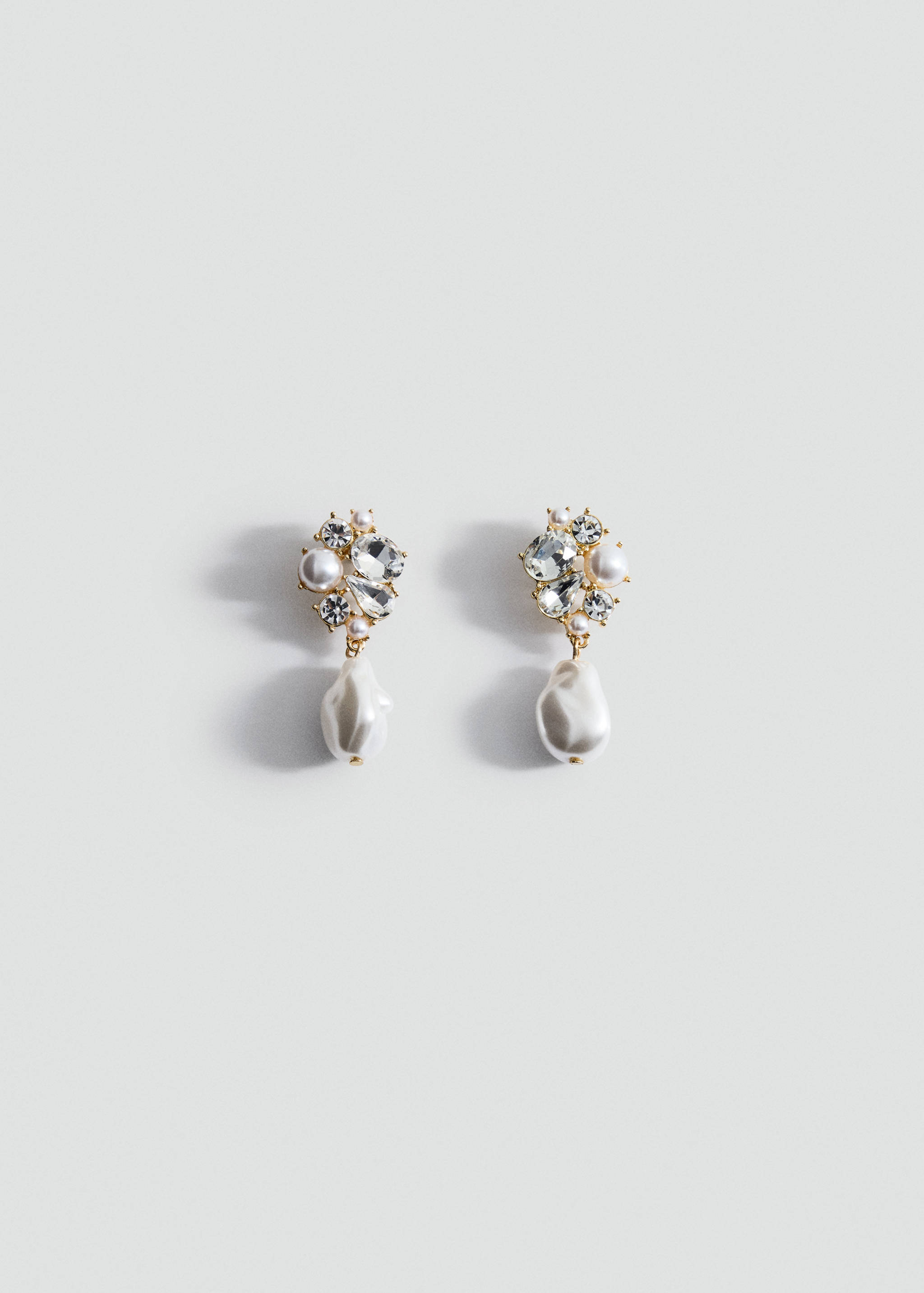Gold-toned cluster earrings with crystal rhinestones and dangling baroque pearls.