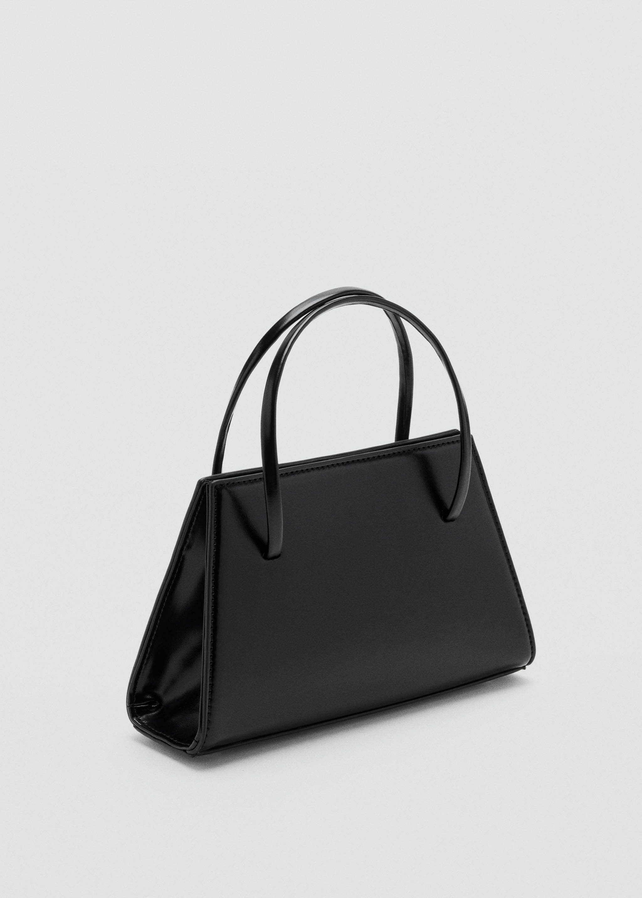 Structured black handbag with a glossy finish and two thin top handles.