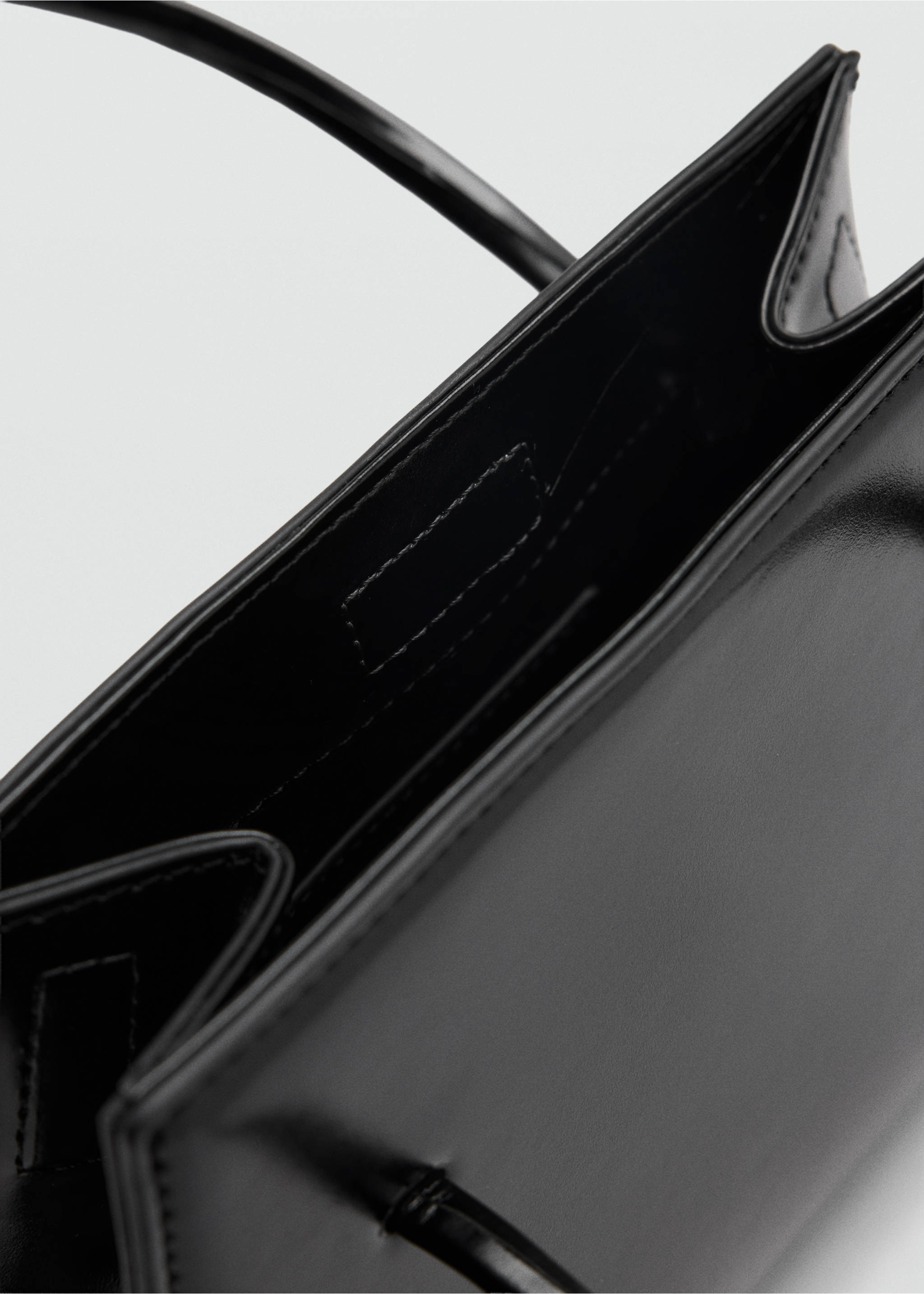 Close-up of the interior of a black handbag., Black. Ref: 37019143-00.