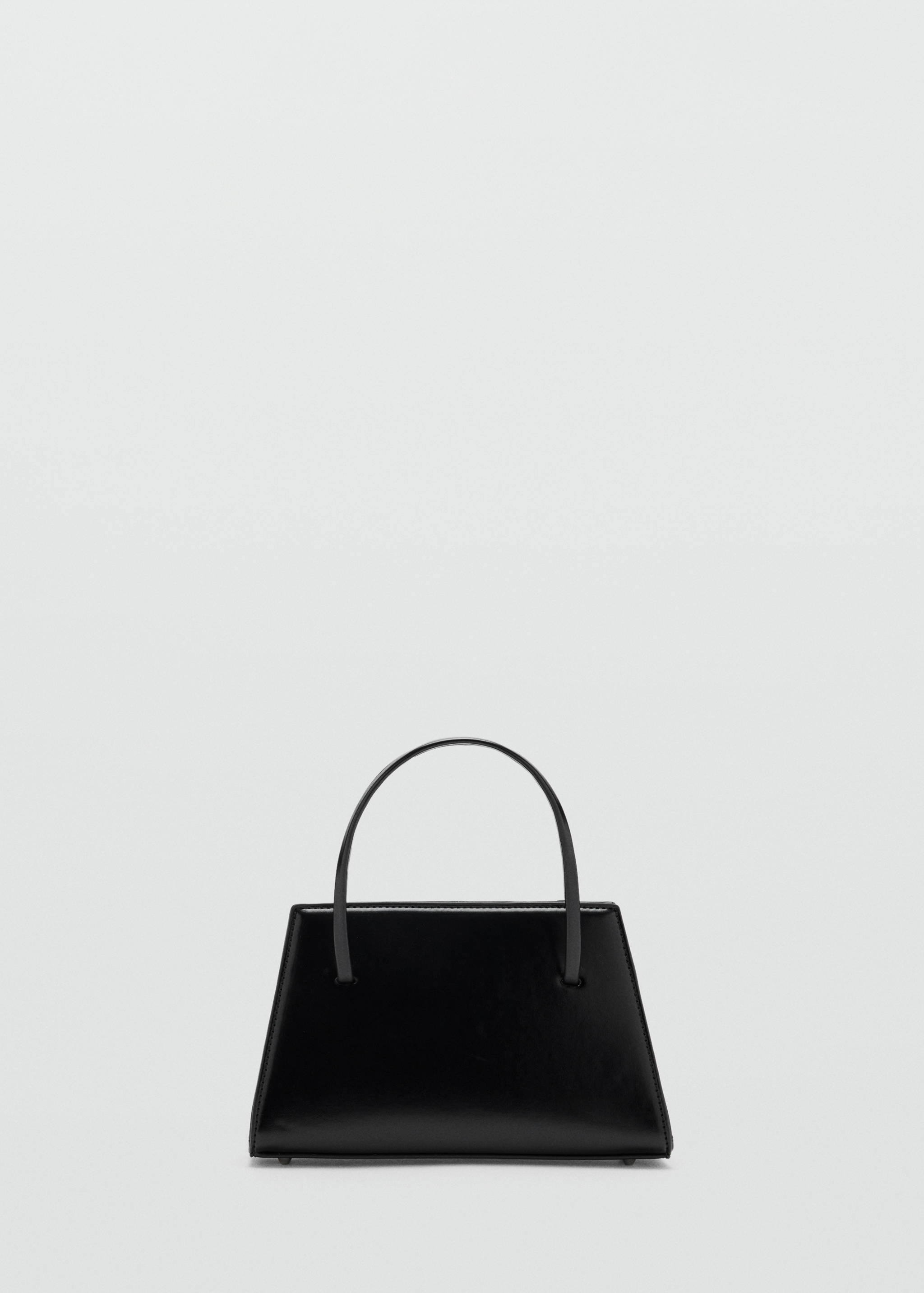 Black structured handbag with a polished finish and curved top handle.