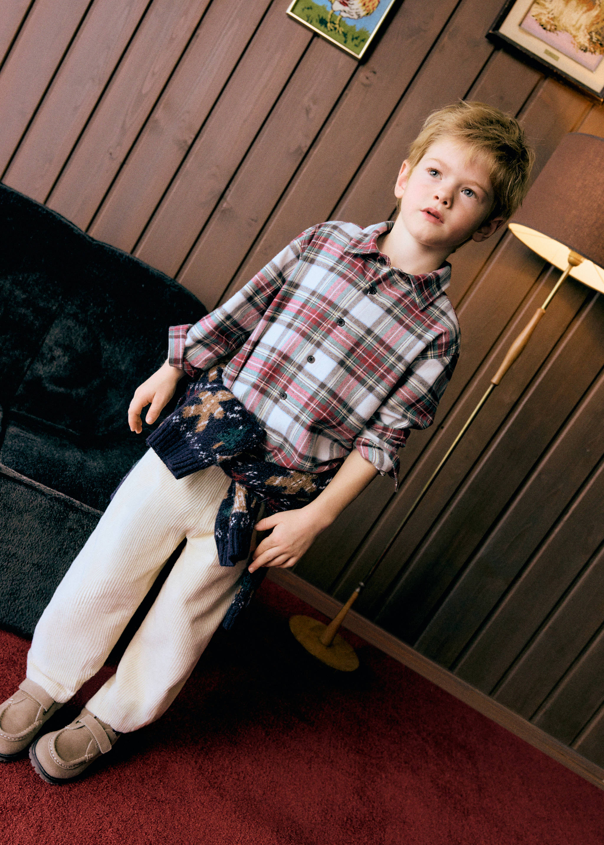 Multi-colour plaid long-sleeved shirt with a collar and buttons.