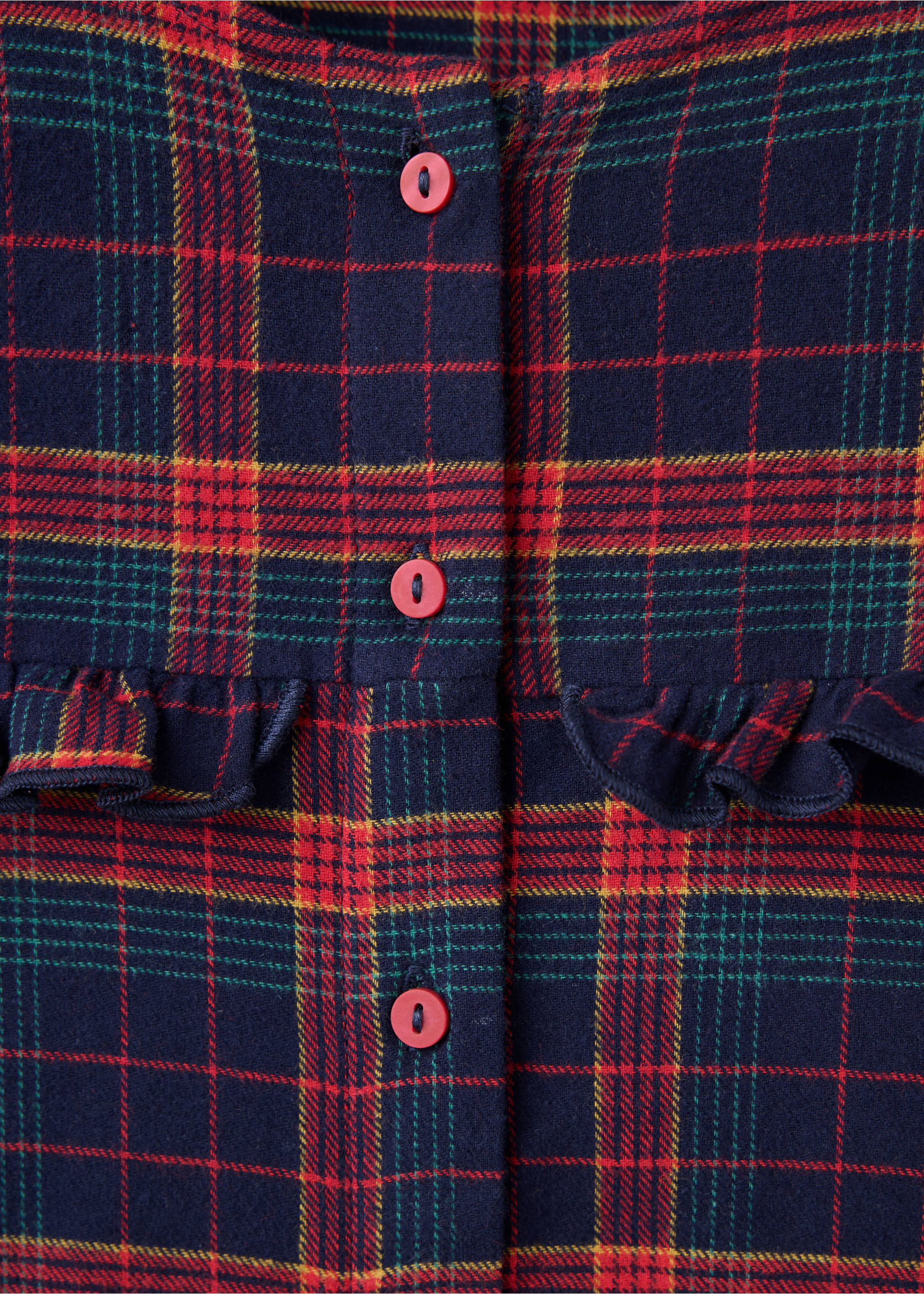 Close-up of a plaid pyjama fabric with red buttons and a ruffled chest trim., Navy. Ref: 37019213-00.