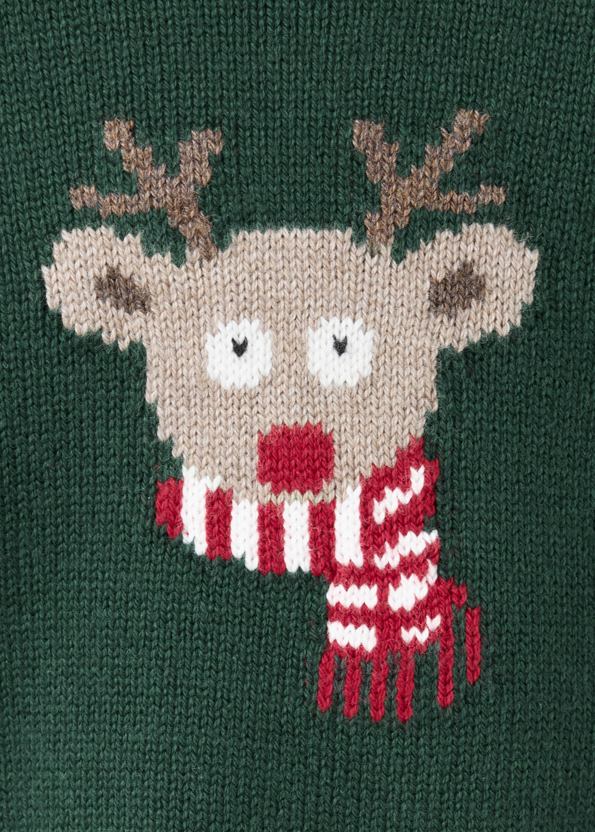 Close-up of a green knitted jumper featuring a reindeer motif with a red nose and striped scarf.