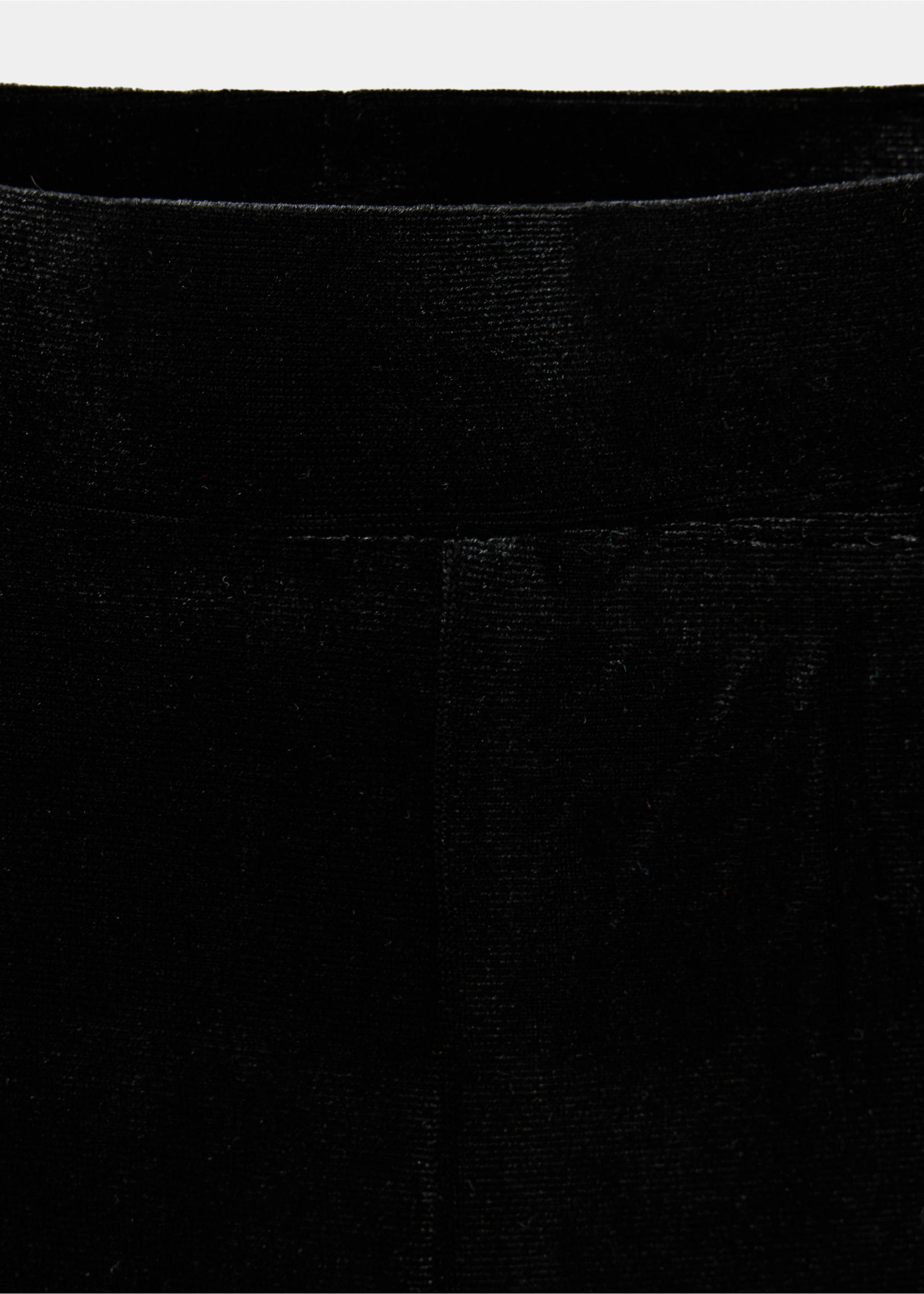Close-up of black trousers featuring a smooth, textured elastic waistband., Black. Ref: 37019223-00.
