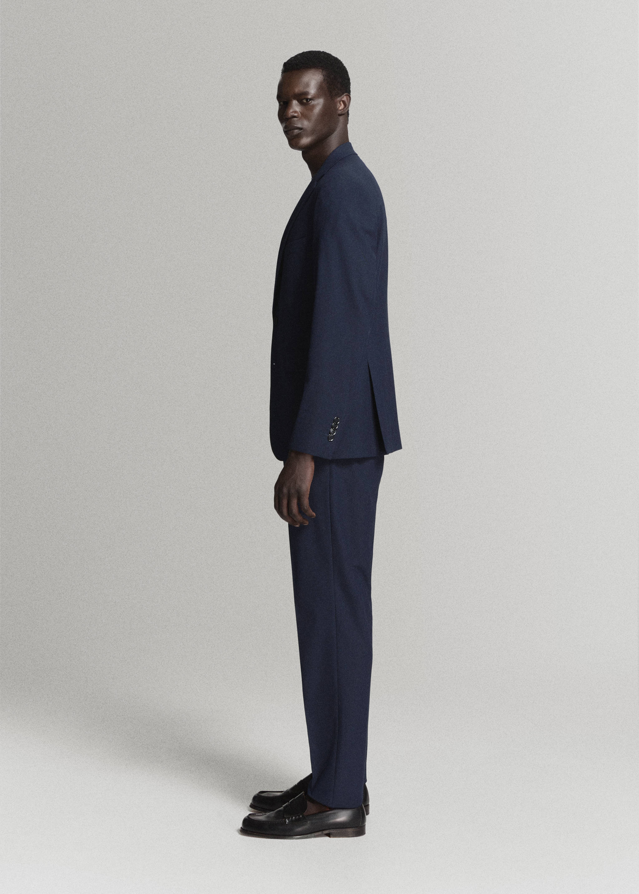 Navy blue trousers with a straight fit, worn as part of a suit.