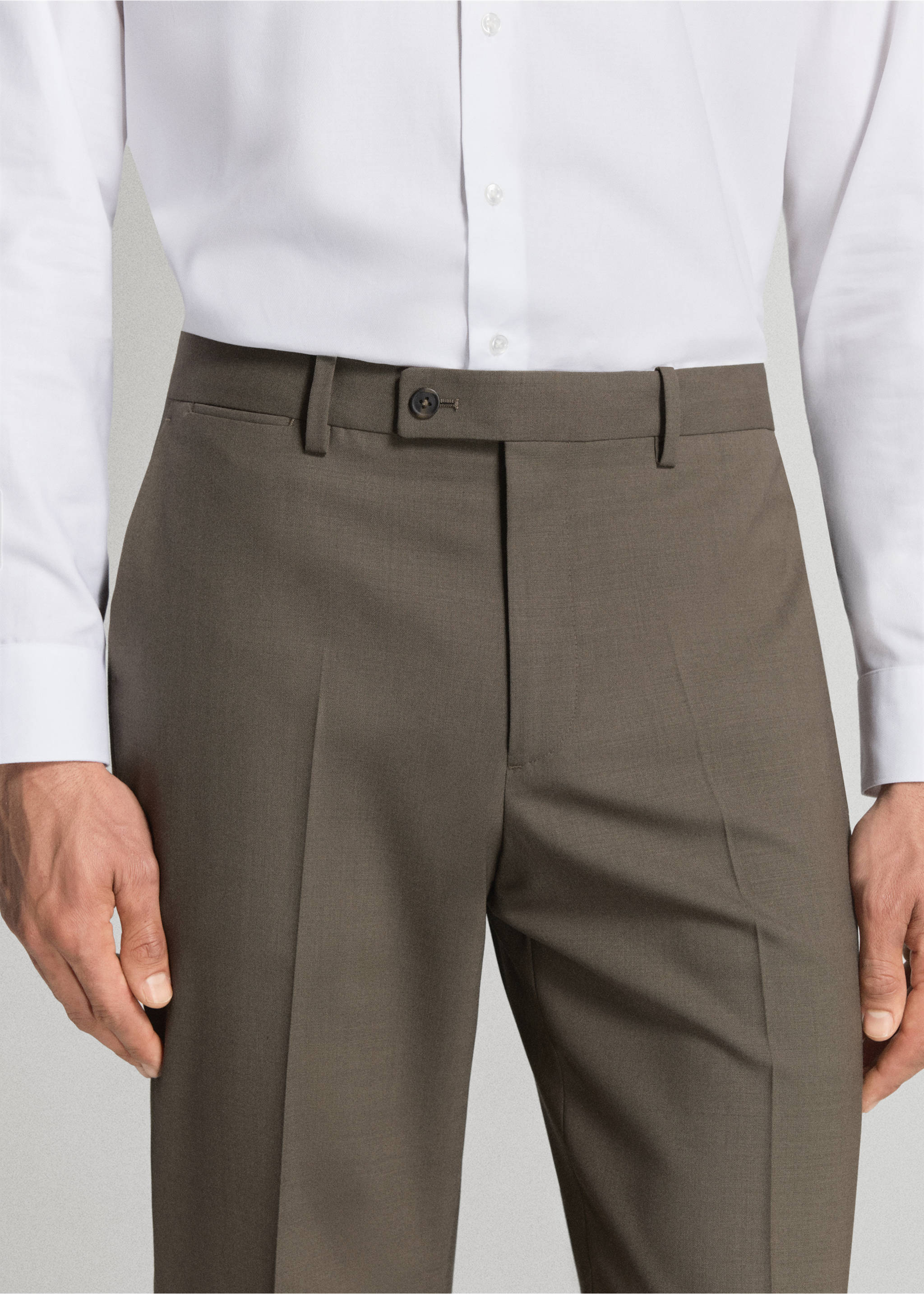 Dark olive trousers with belt loops and a buttoned waistband, worn with a white shirt., Medium Brown. Ref: 37021420-01.