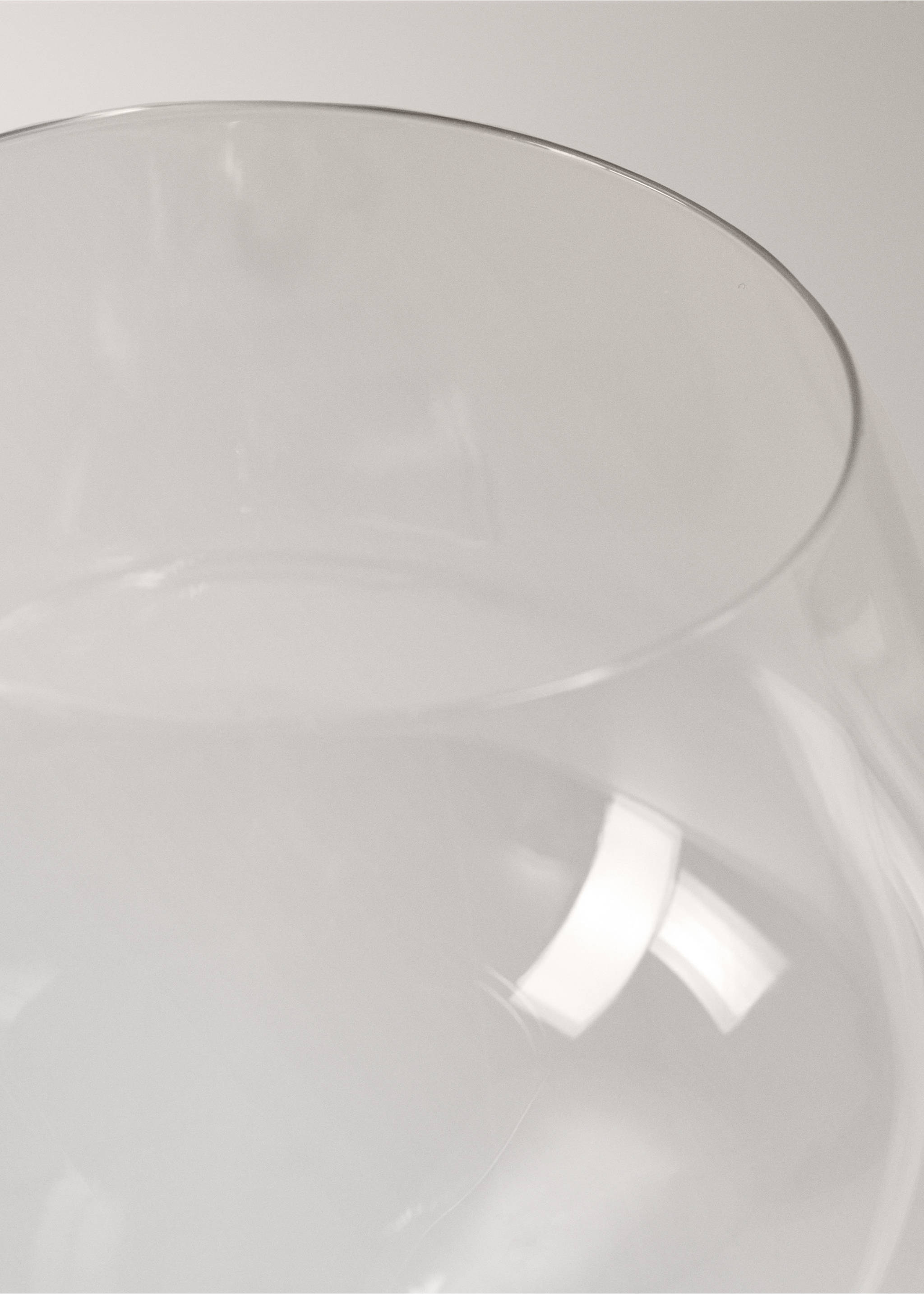 Close-up detail of a clear glass goblet rim., Ice Grey. Ref: 37023303-00.