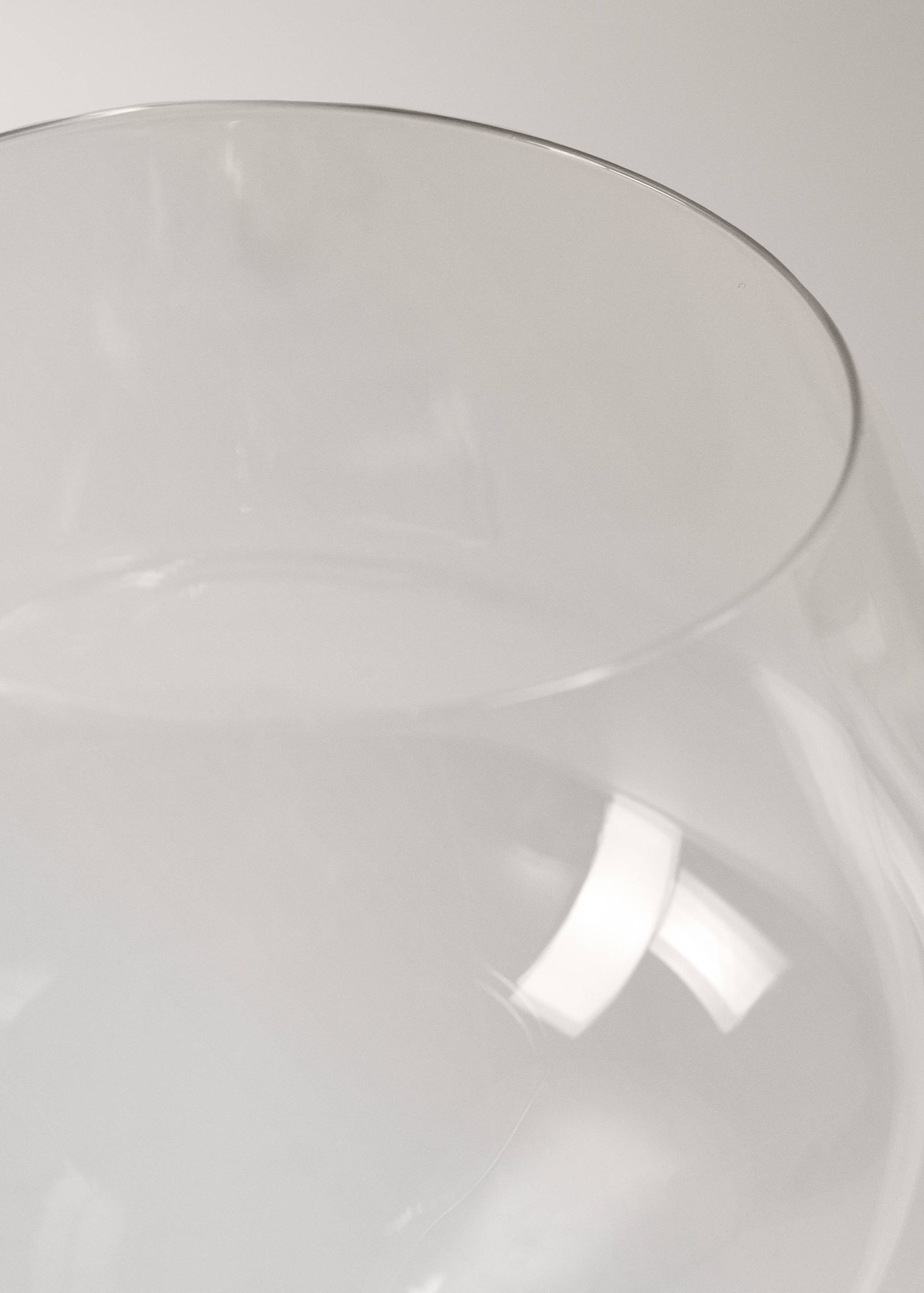 Close-up detail of a clear glass goblet rim.