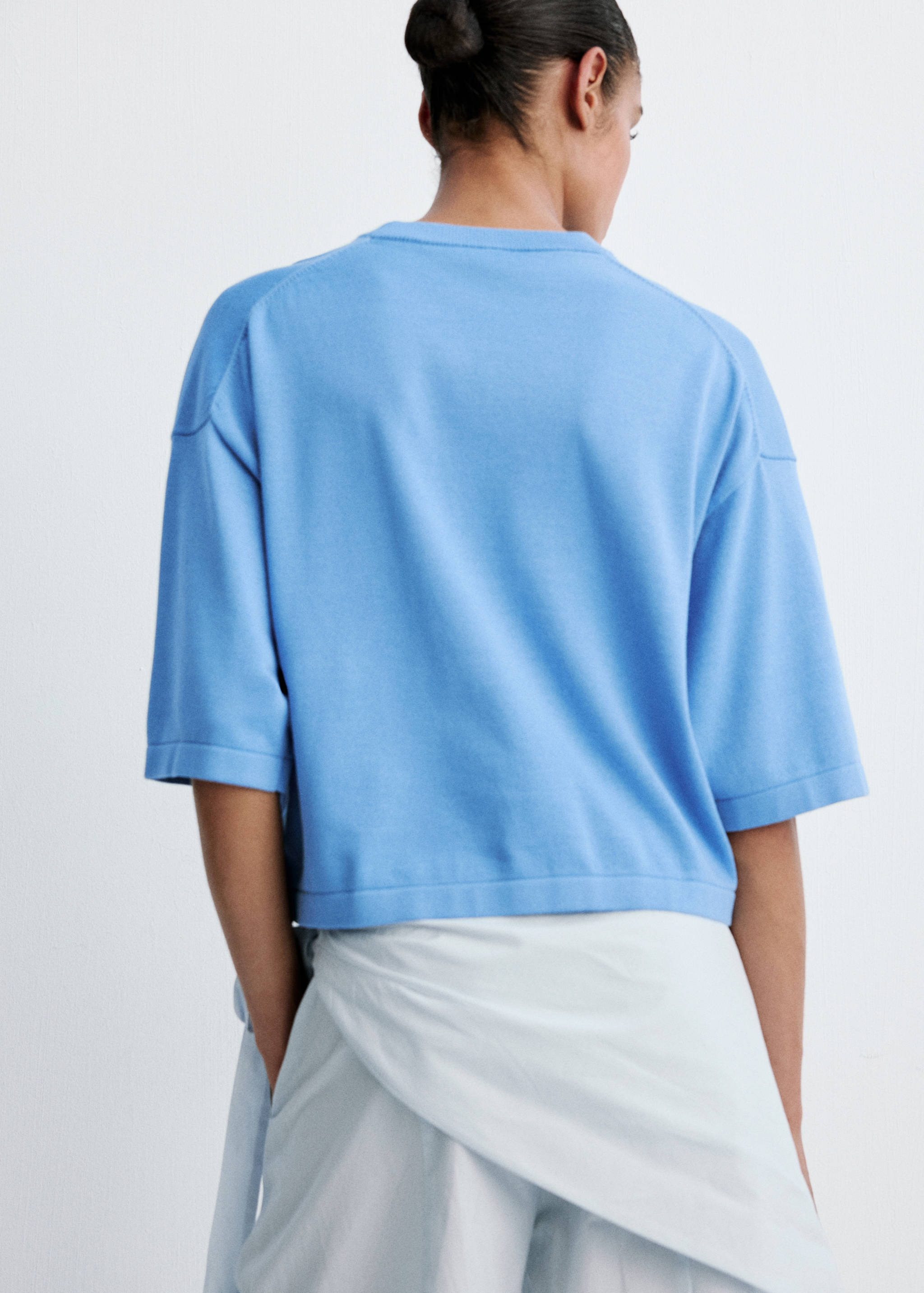 Short-sleeved knitted sweater - Reverse of the article