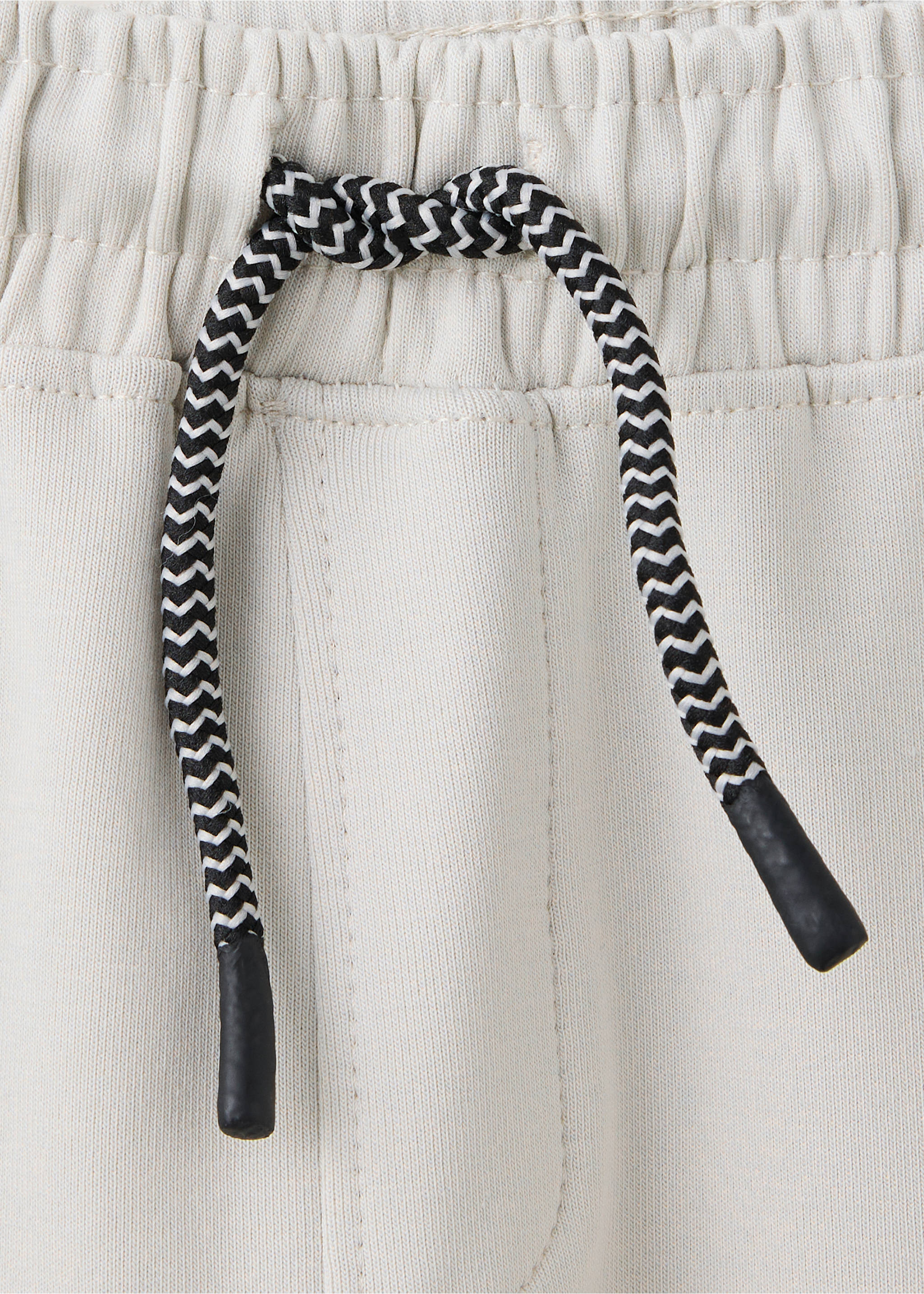 Cotton jogger-style trousers - Details of the article 8, Ice Grey. Ref: 37024429-00.
