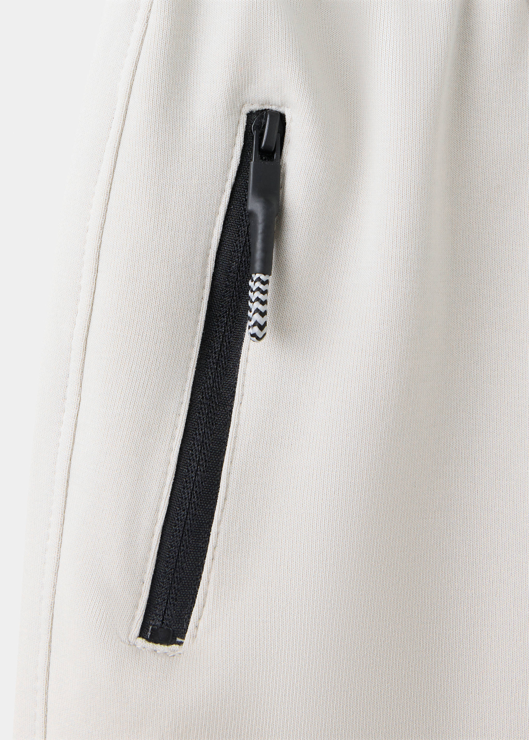 Cotton jogger-style trousers - Details of the article 0