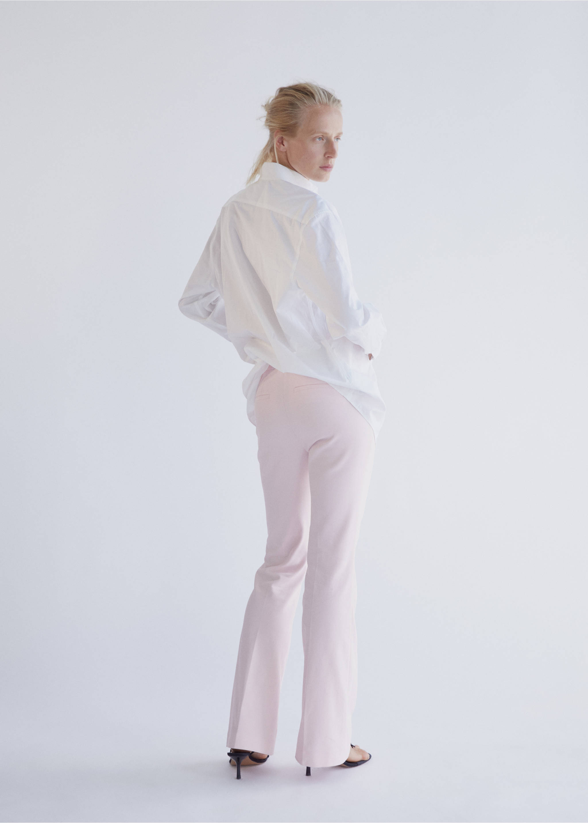Mid-rise flare trousers - Reverse of the article, Pastel Pink. Ref: 37024803-00.