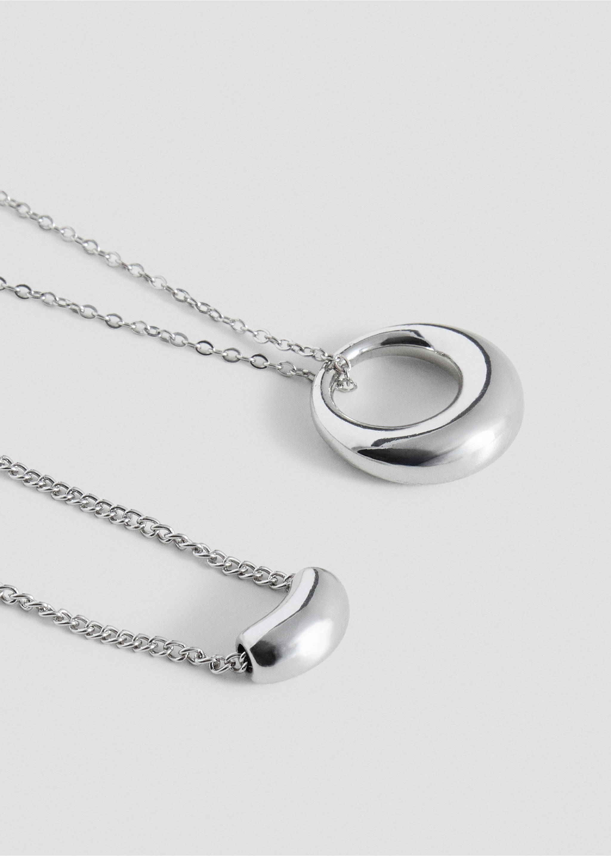 Silver-tone necklace with a chunky rounded ring pendant in a close-up view., Silver. Ref: 37025187-00.