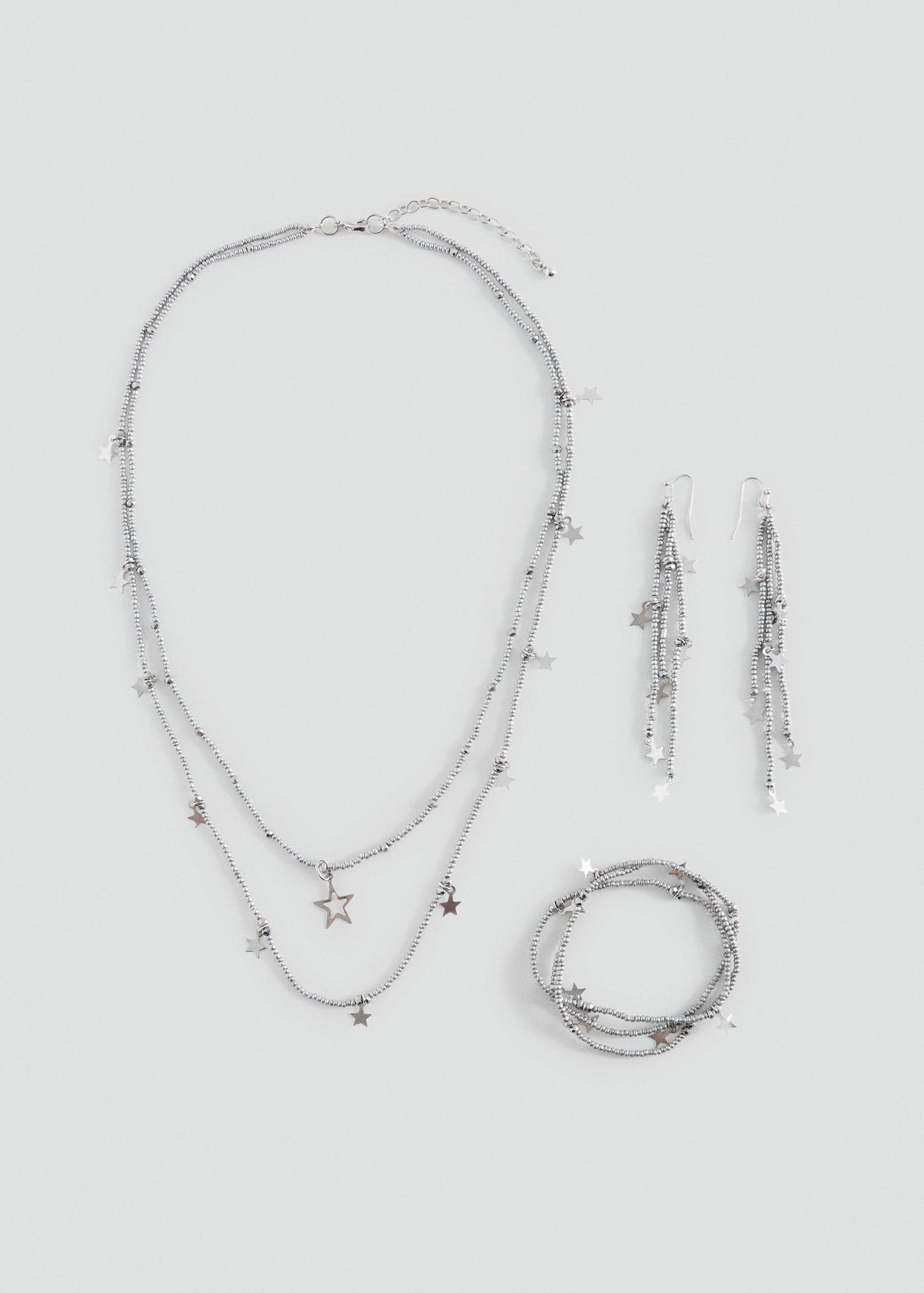 Silver-toned jewellery set featuring bead strands and hanging star charms.