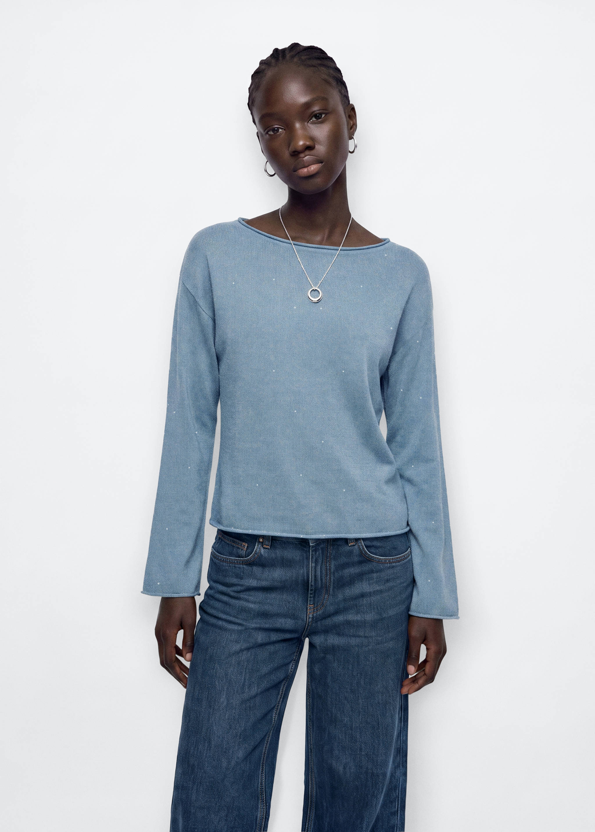 Light blue knitted jersey with a boat neck, long sleeves, and scattered rhinestones.