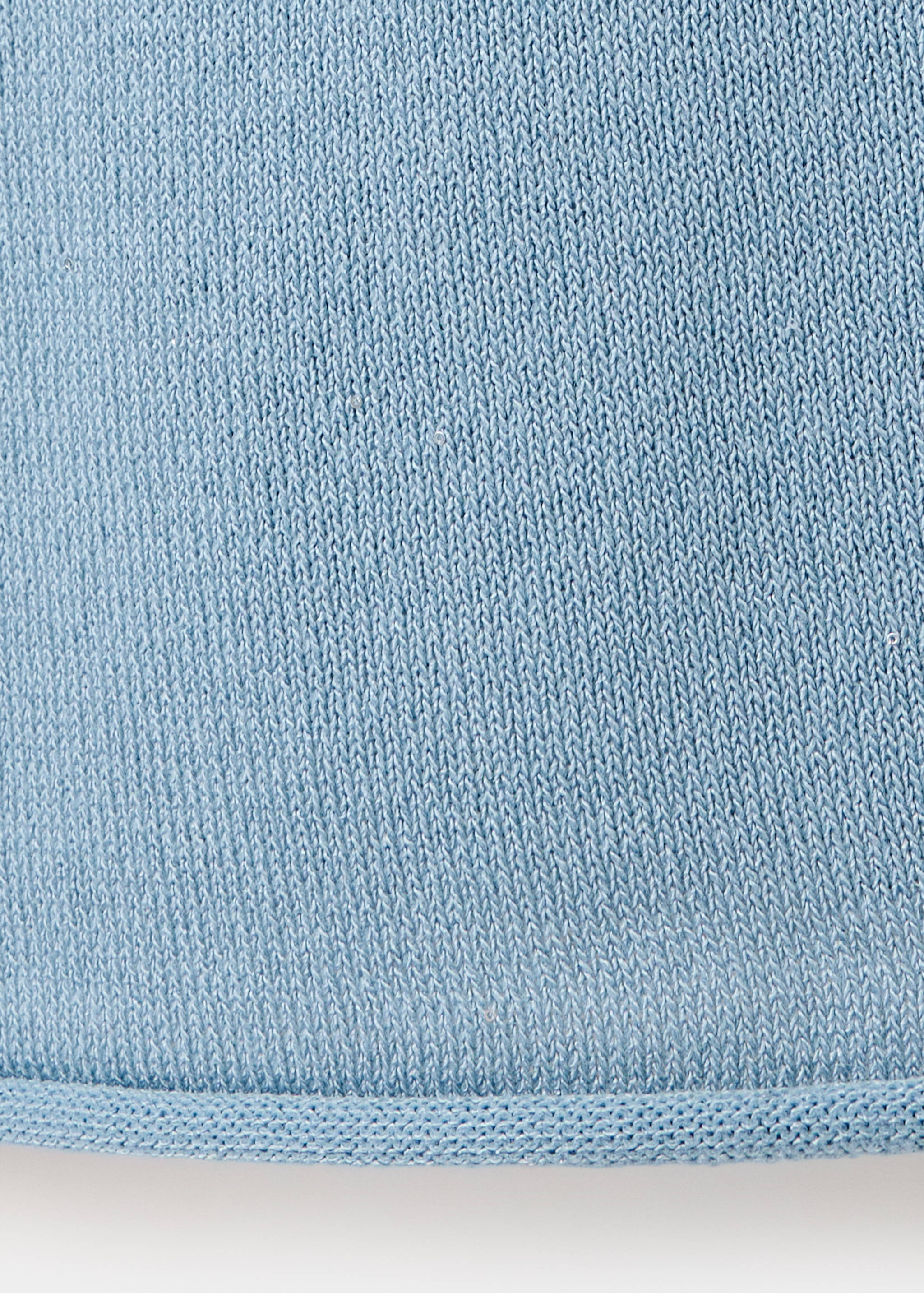 Close-up of a light blue knit jersey fabric texture.