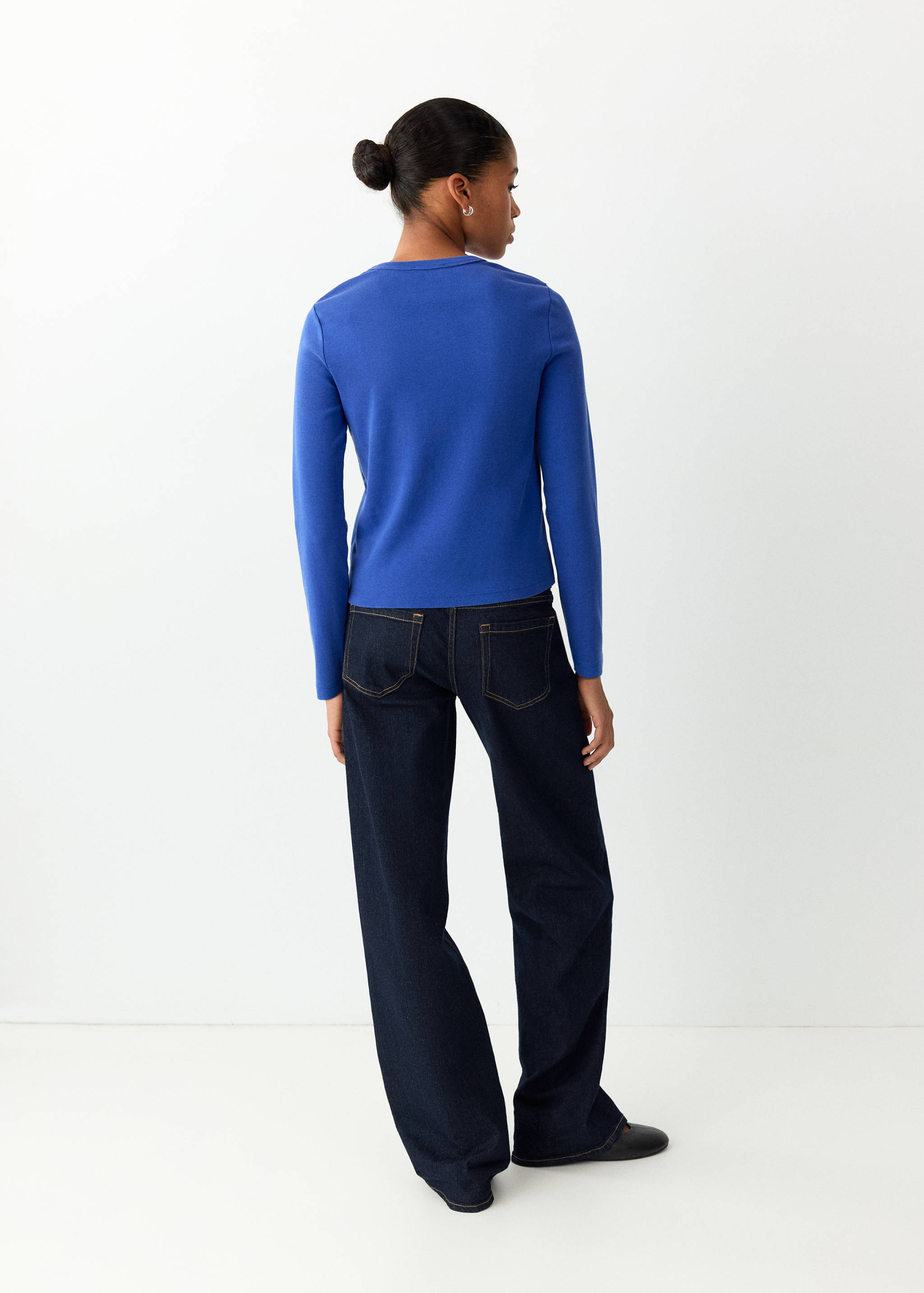 Blue long-sleeved t-shirt viewed from the back.
