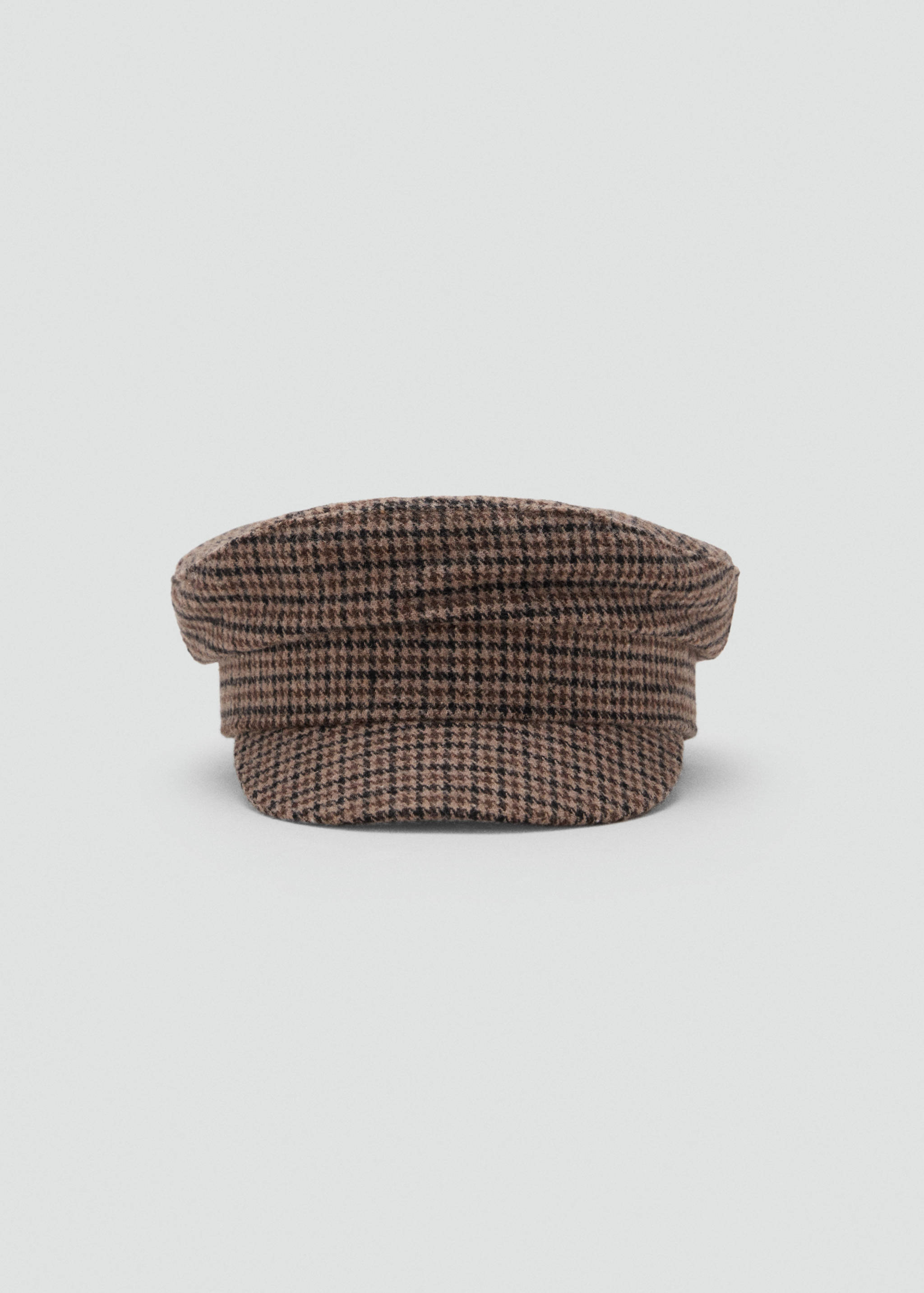 Brown and black houndstooth flat cap with a stiff brim.