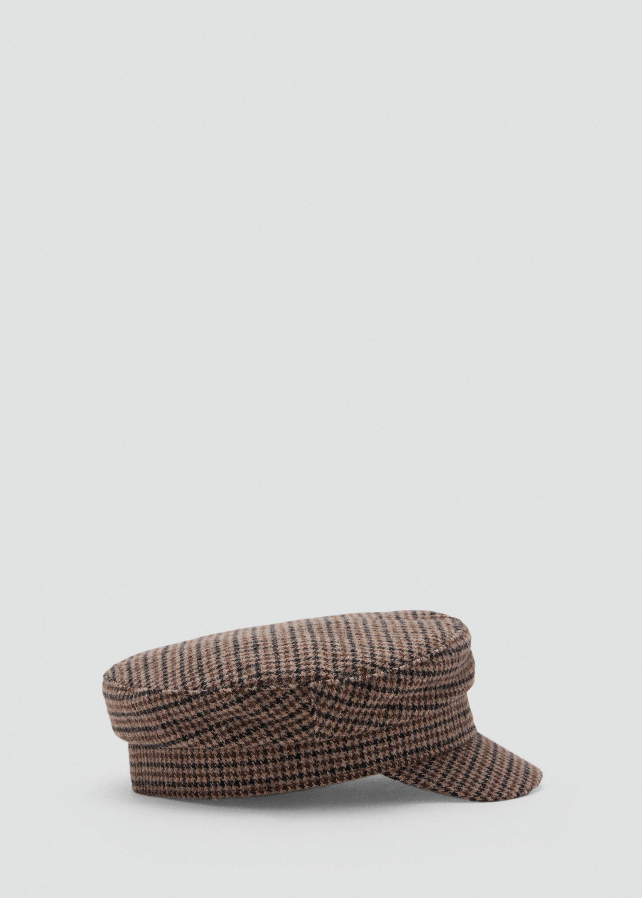 Brown and black houndstooth cap with a flat crown and short visor.