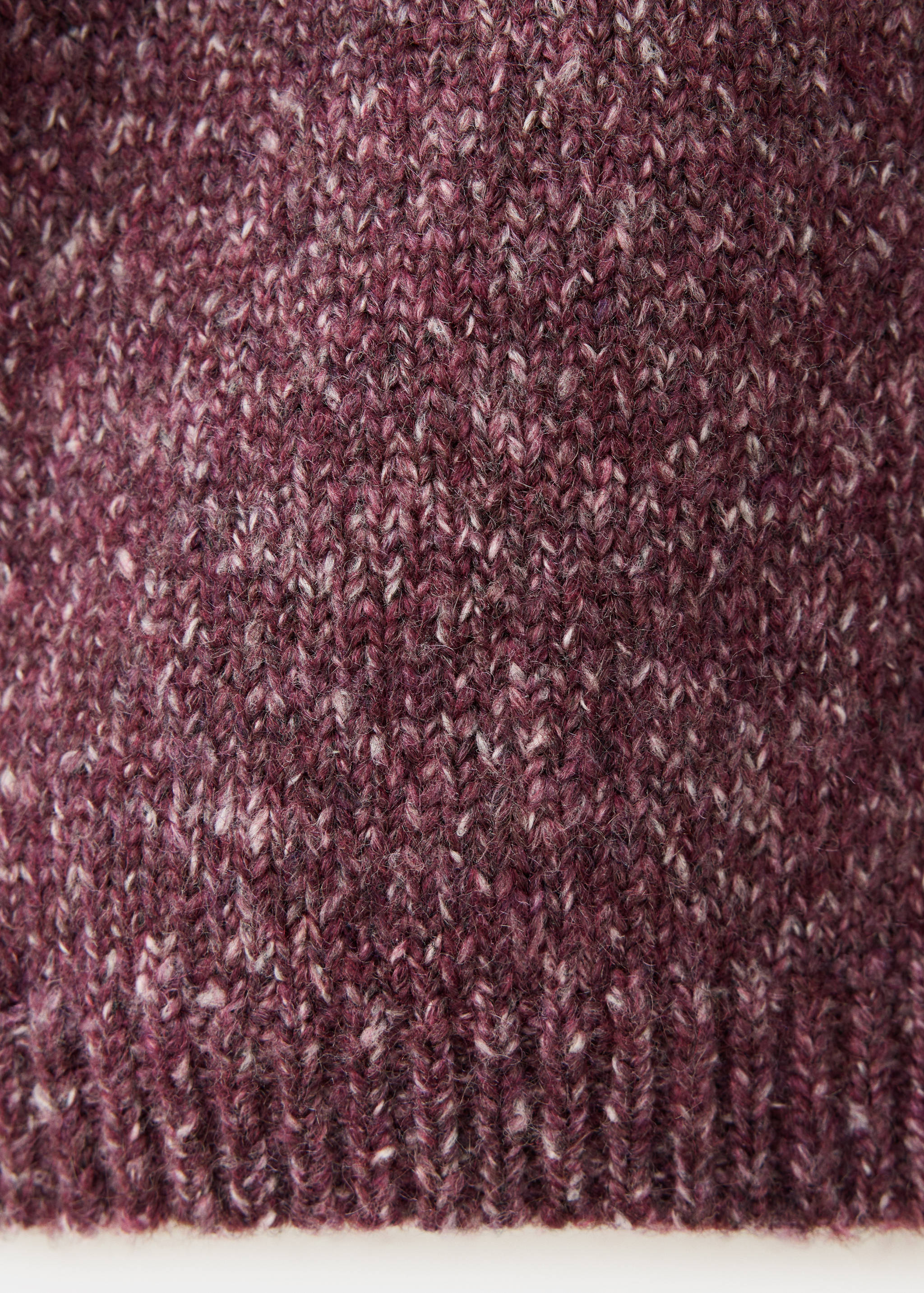 Plum knitted kids jersey close-up showing heathered yarn texture and ribbed hem