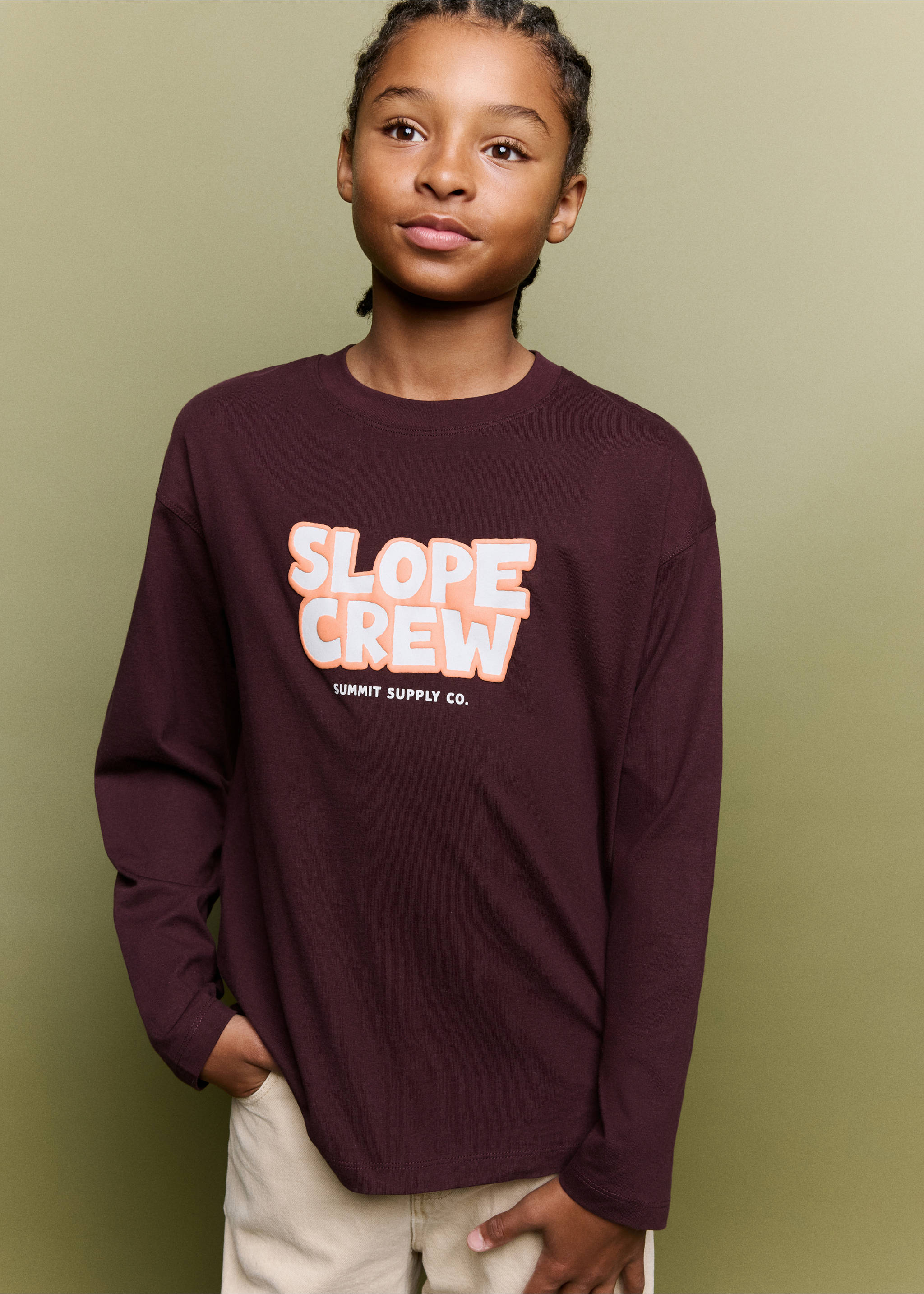 Burgundy long-sleeve t-shirt with a crew neck and a bold 'Slope Crew' chest graphic., Burgundy. Ref: 37027131-00.