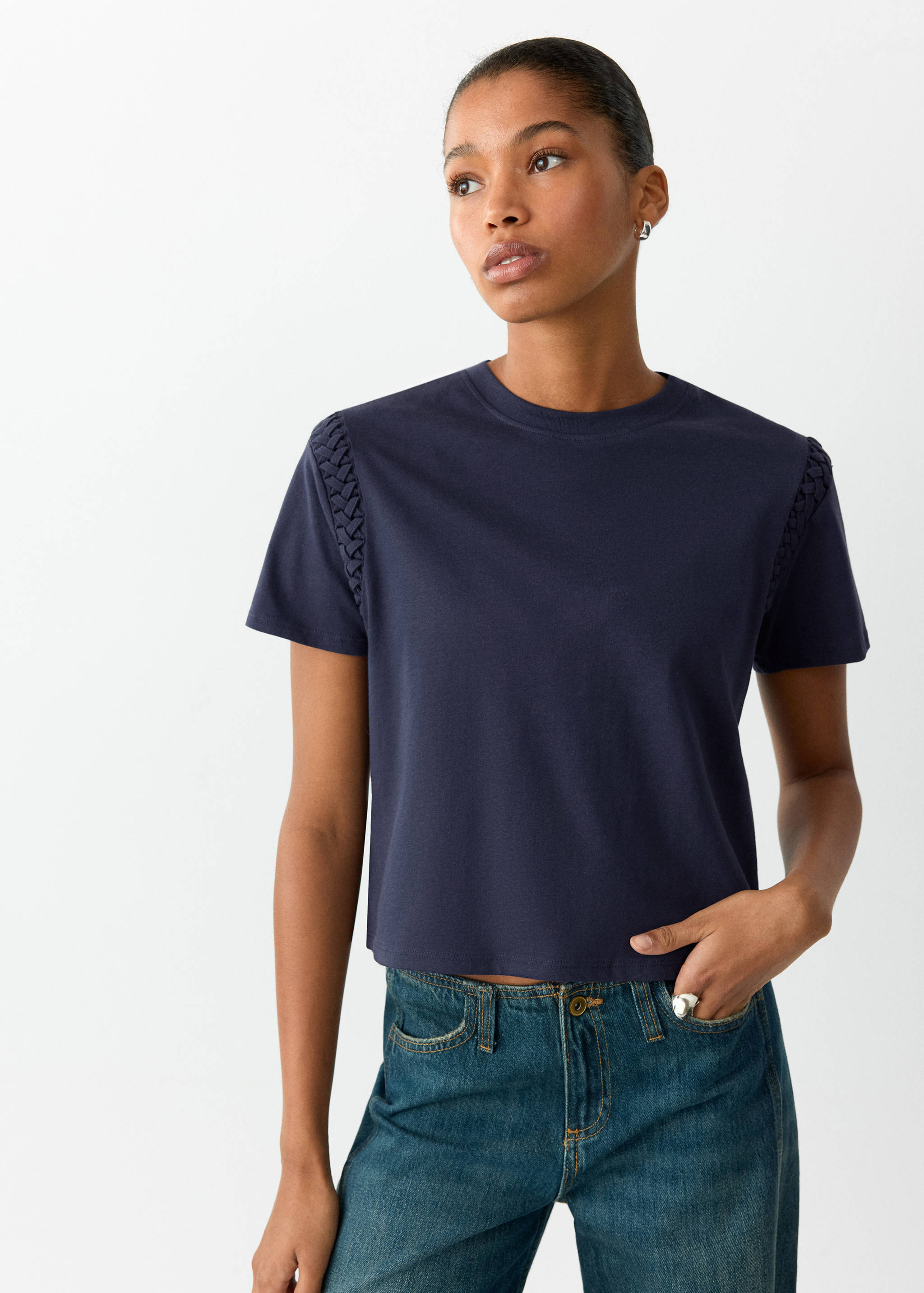 Navy blue short-sleeved T-shirt with a round neck and braided shoulder details.