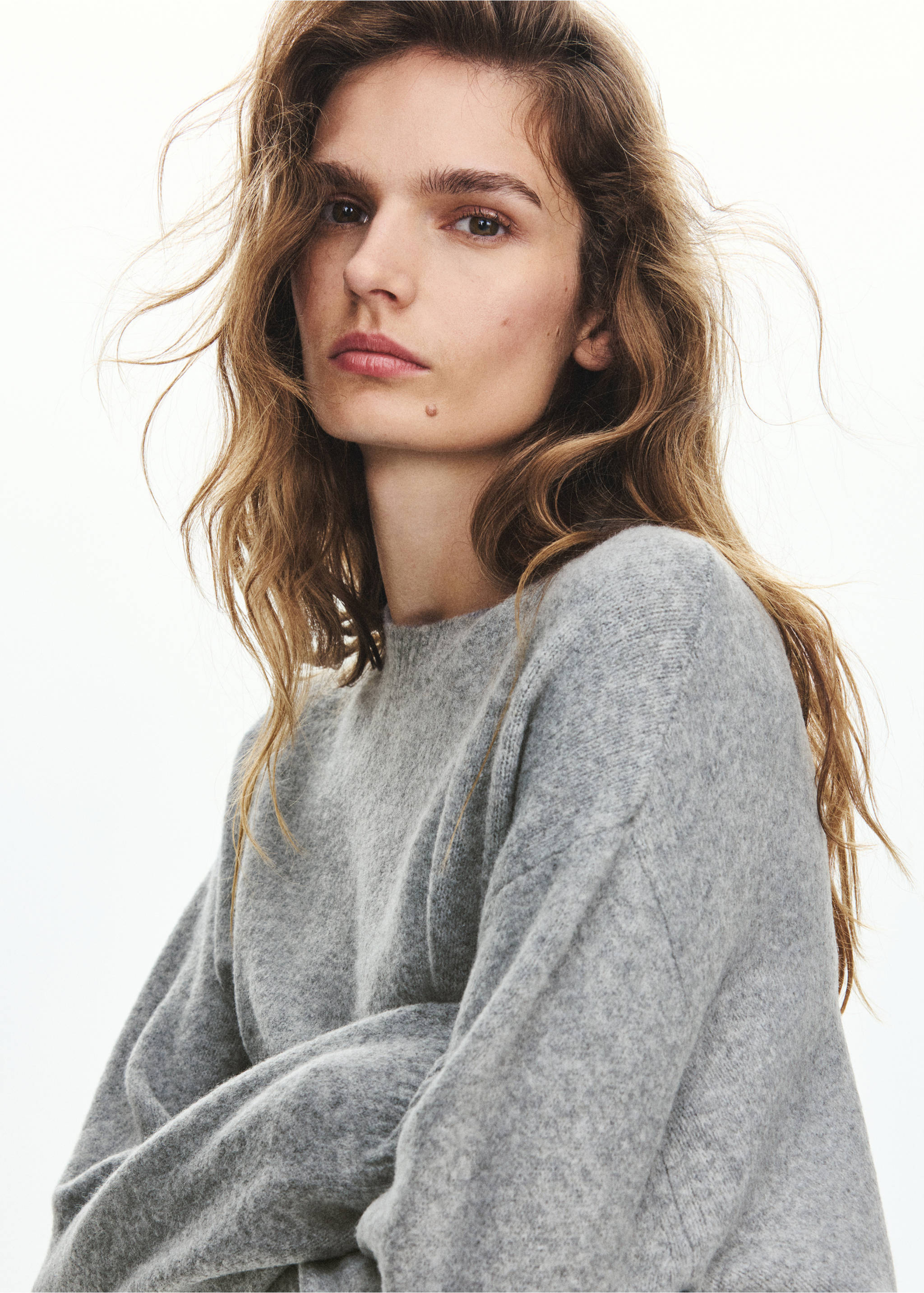 Close-up of a model wearing a grey knit sweater., Grey. Ref: 37027775-00.
