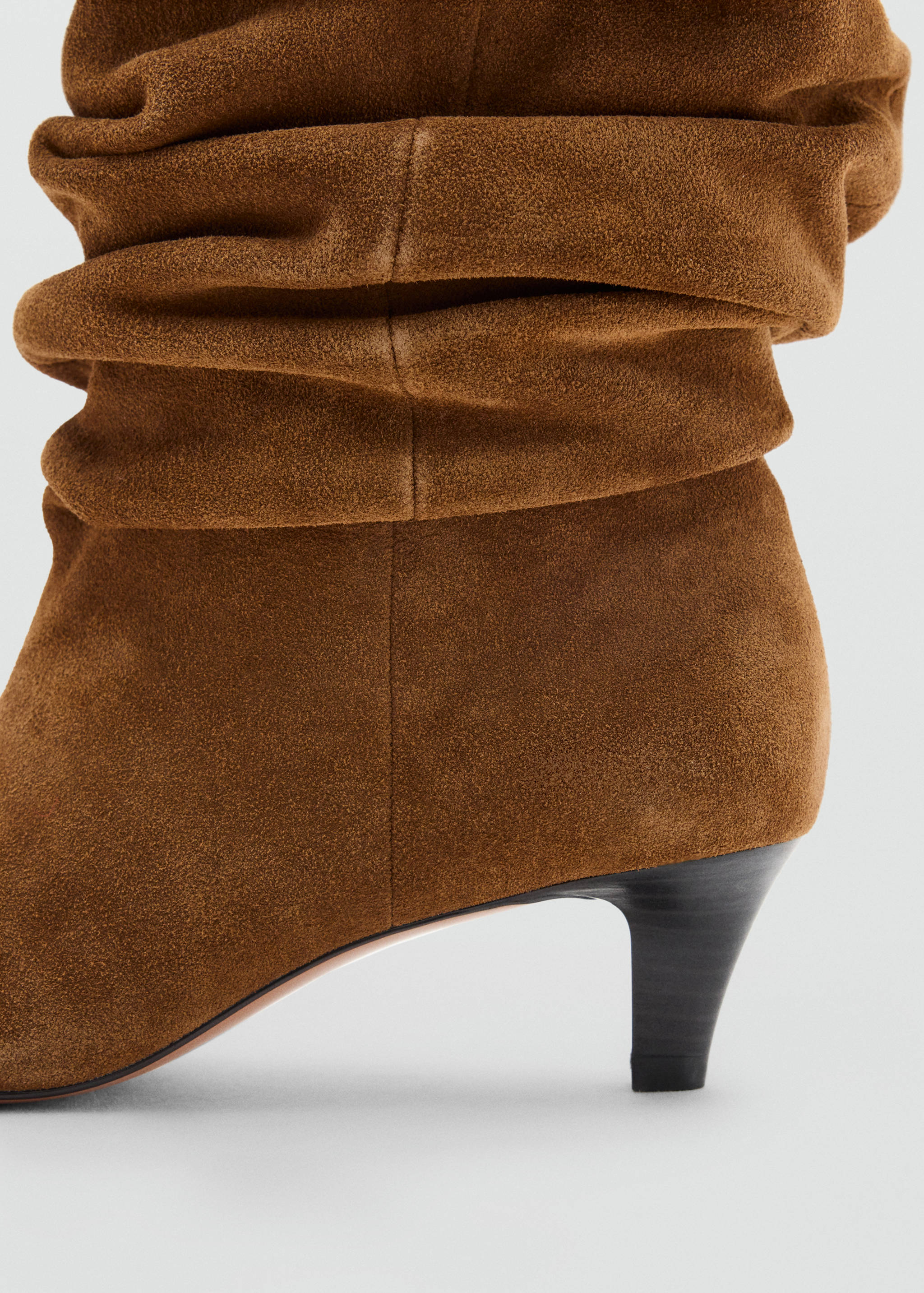 Brown suede ankle boot with a slouchy shaft and kitten heel