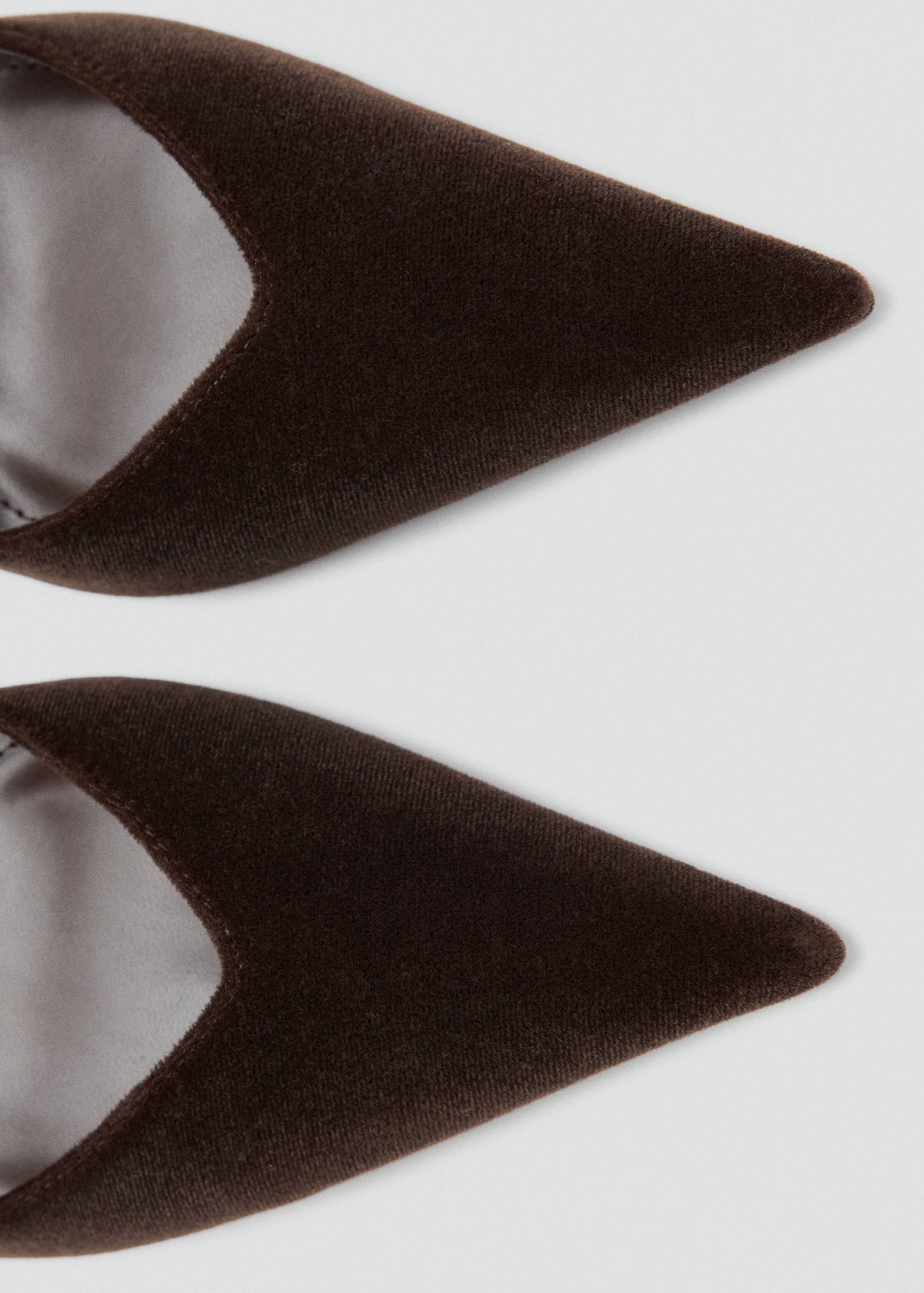 Brown velvet pointed shoes, close-up detail.
