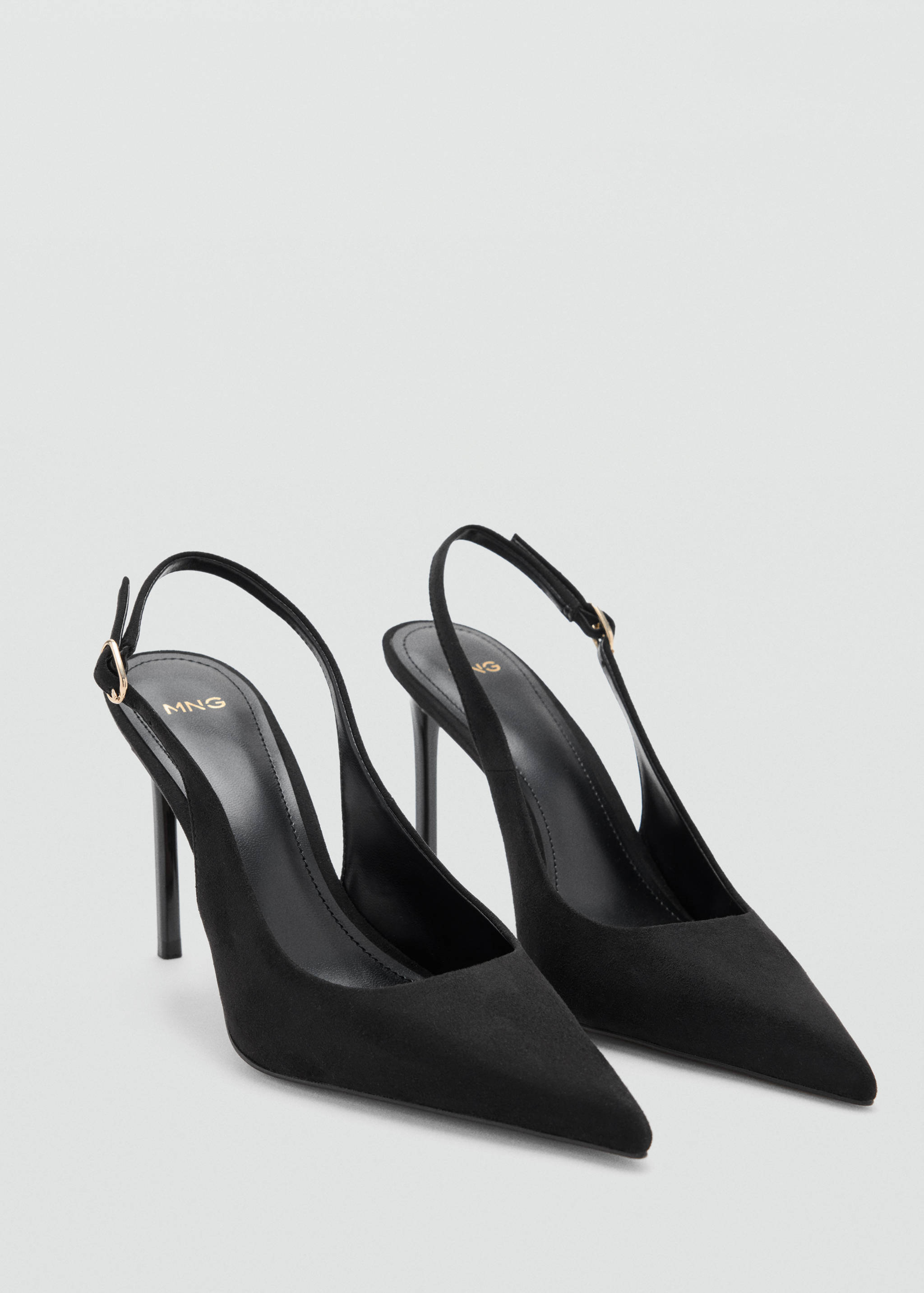 Black pointed-toe slingback high heels with slim stiletto heels.