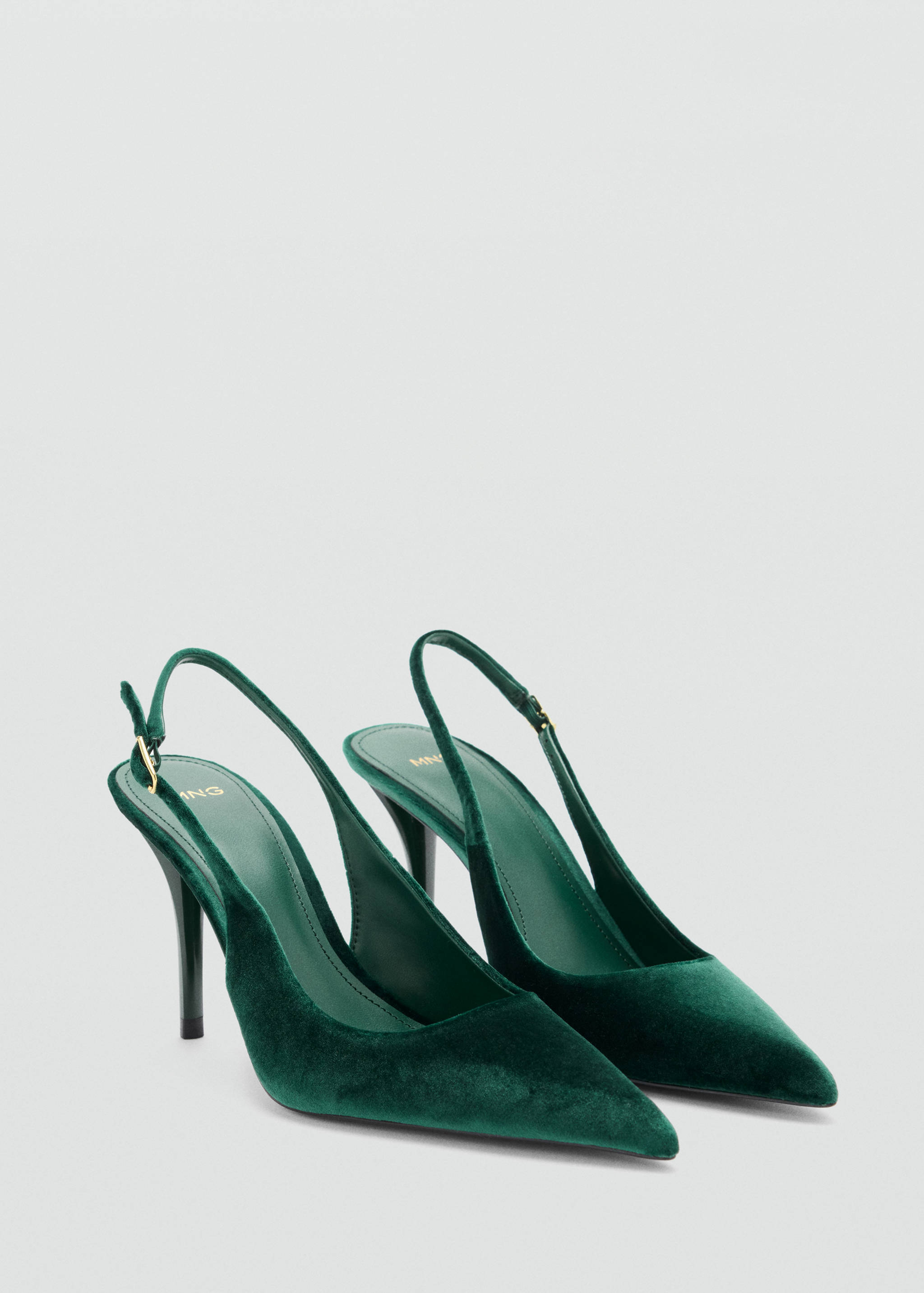 Dark green velvet slingback shoes with pointed toe and stiletto heel.