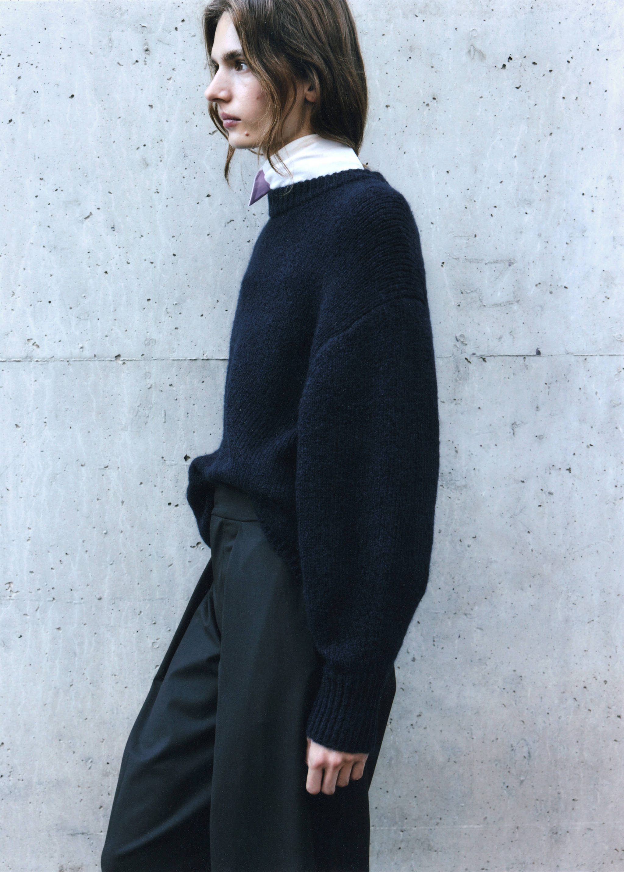 Navy blue crew-neck sweater with a relaxed fit and ribbed trims.