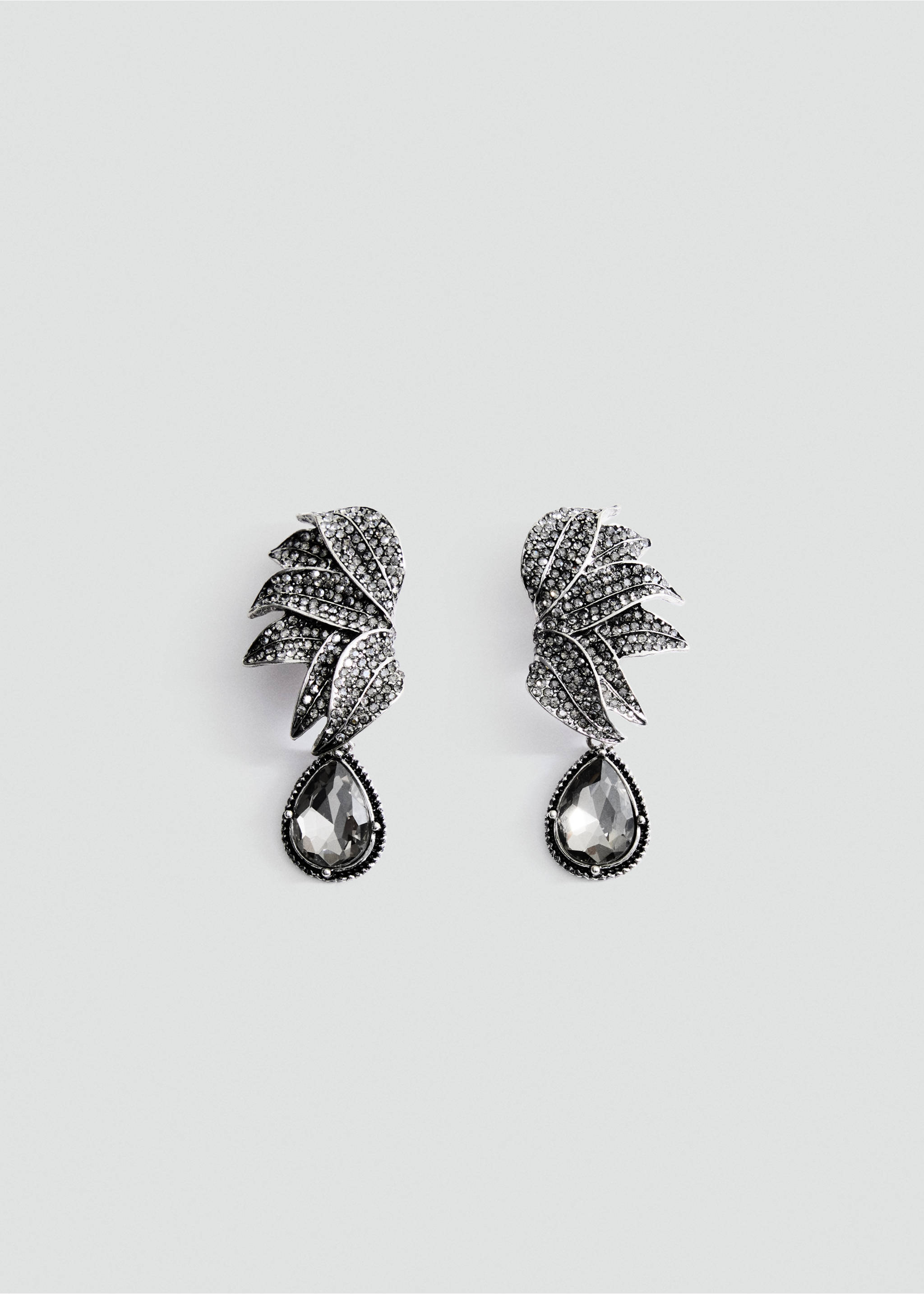 Silver-toned statement earrings with rhinestone-encrusted layered leaves and hanging dark teardrop stones., Silver. Ref: 37027797-00.