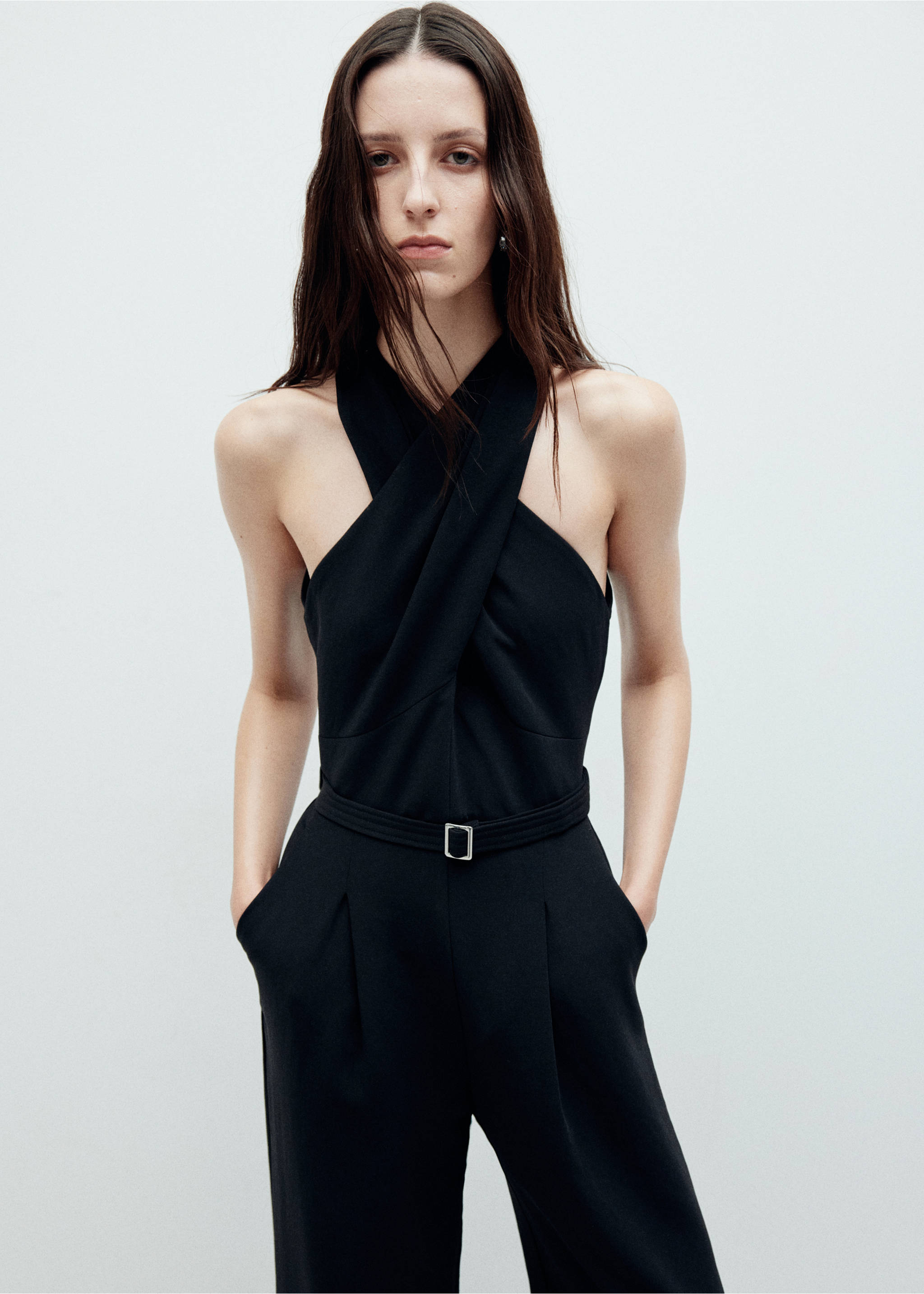 Black jumpsuit with a halter cross-over neck and belted waist., Black. Ref: 37027808-00.