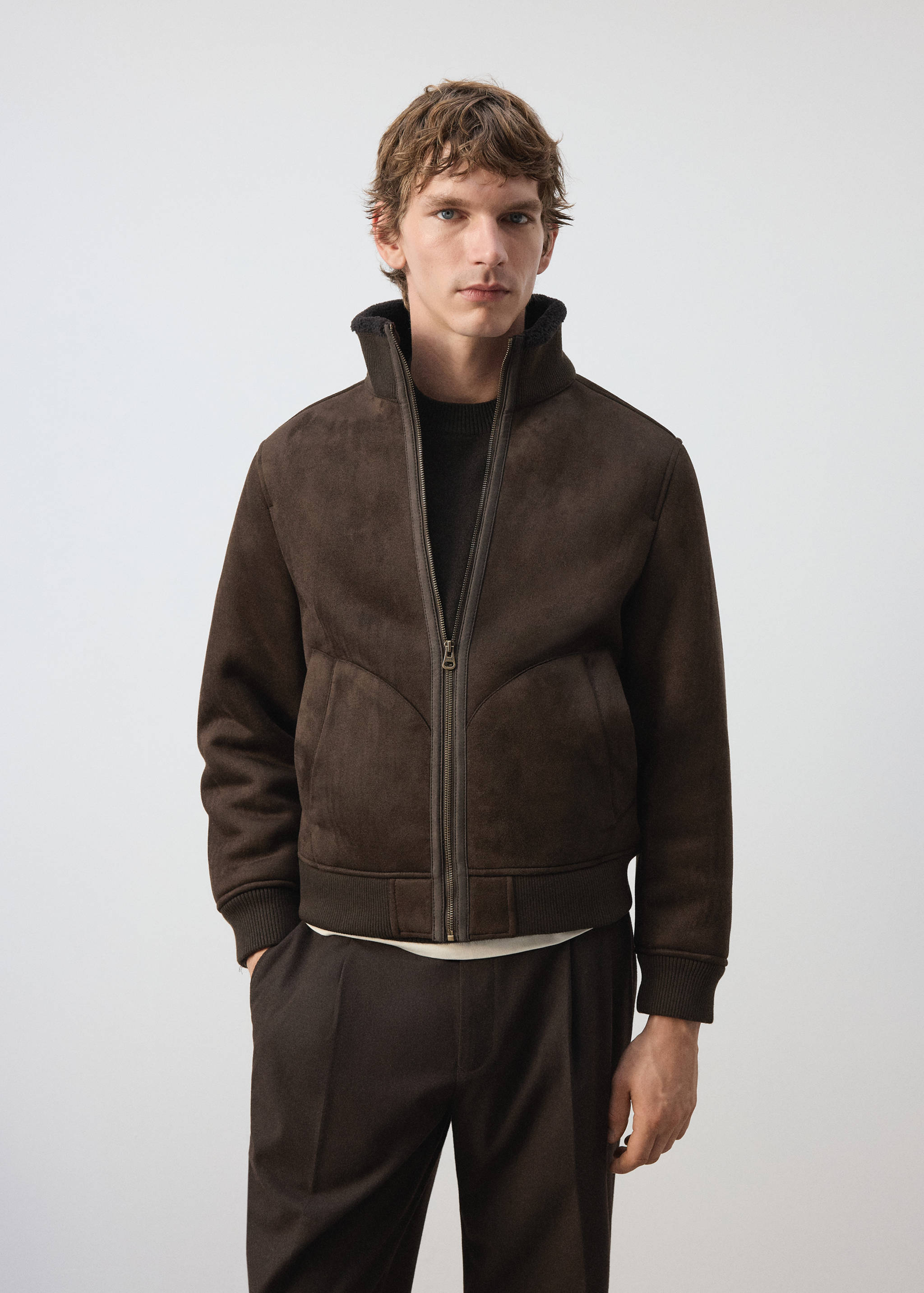 Dark brown zip-up jacket with a high funnel neck and ribbed trims.
