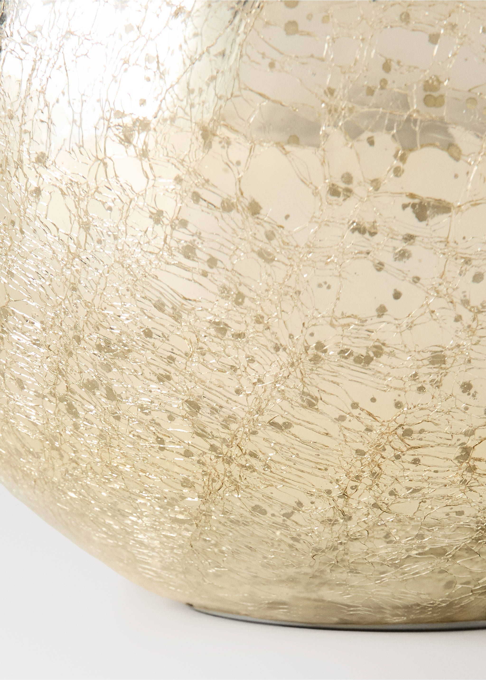 Close-up of a crackled metallic gold Christmas ornament detail., Gold. Ref: 37027896-00.