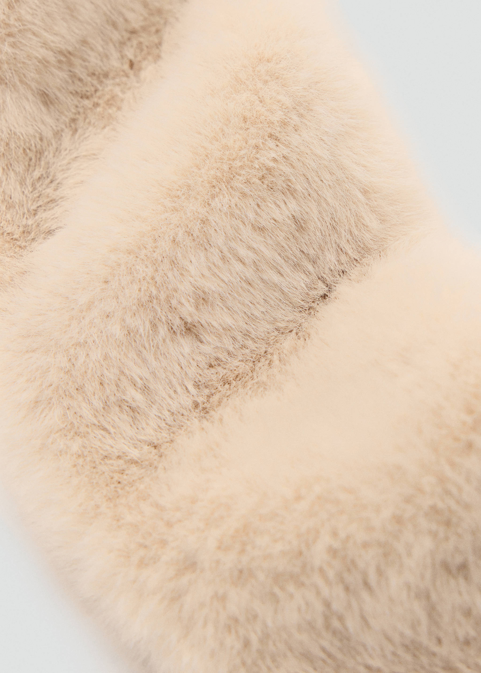 Beige faux-fur scarf detail.