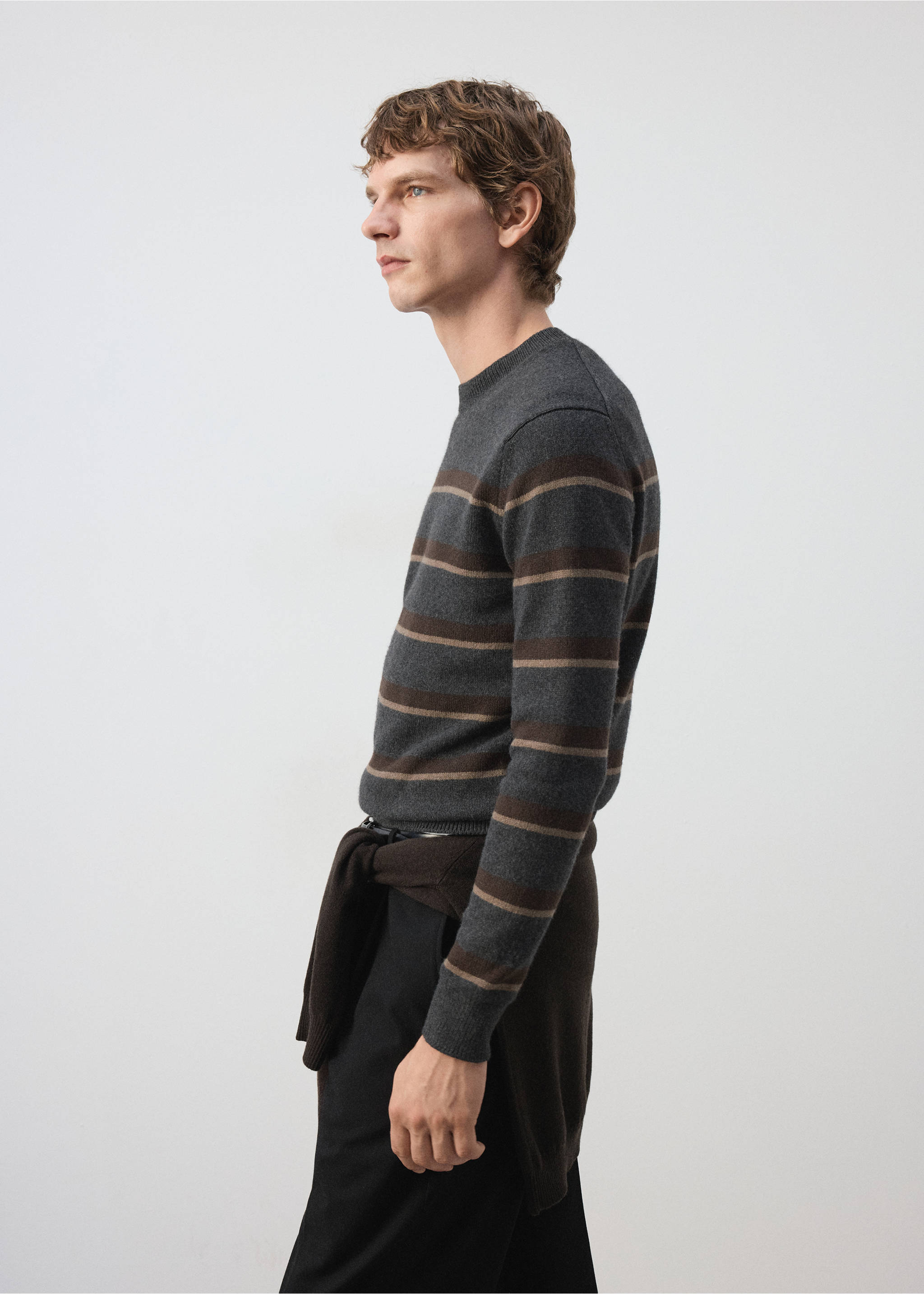 Grey, brown and beige striped crew neck jersey worn with black trousers., Dark Heather Grey. Ref: 37027909-00.