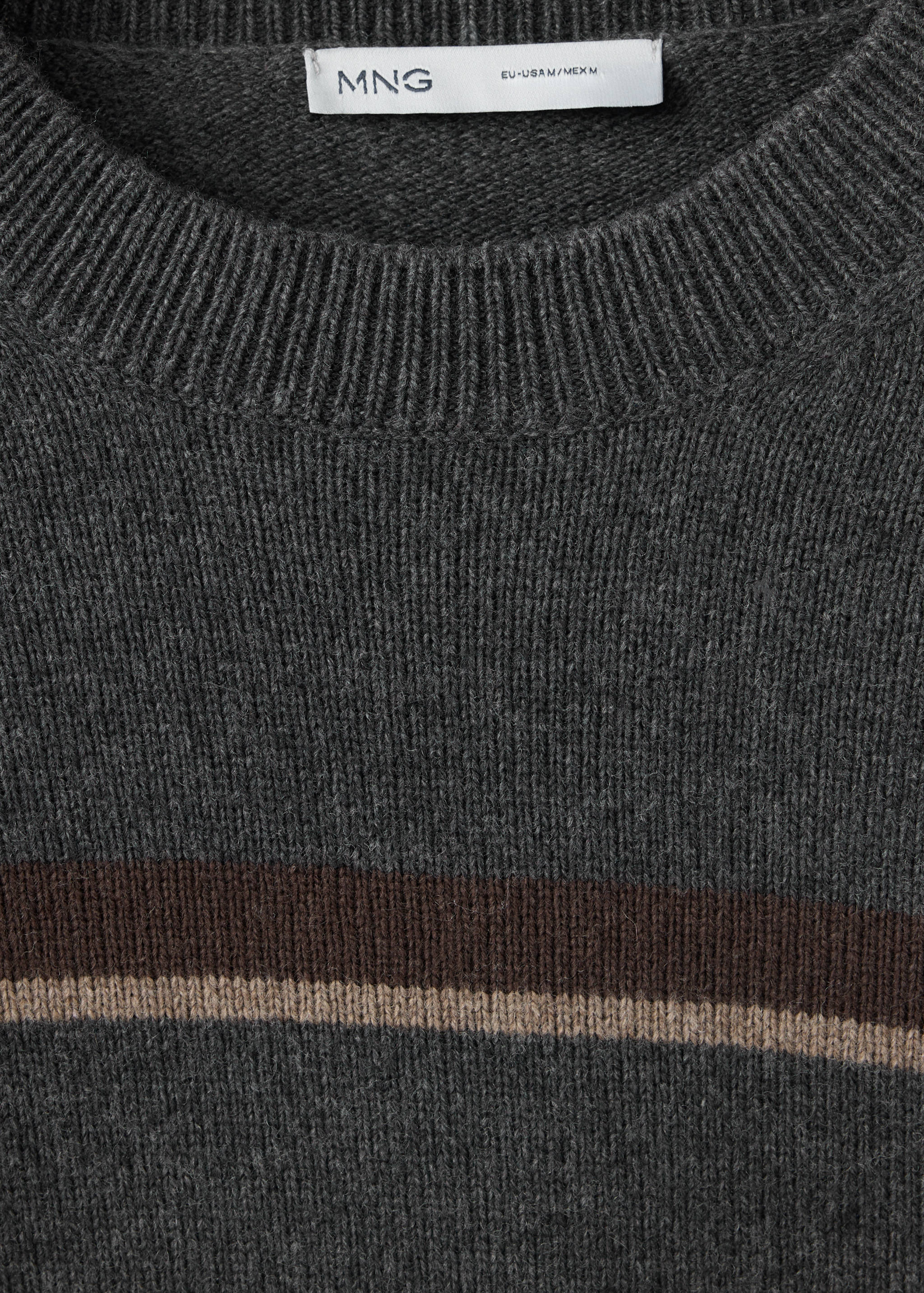 Close-up of a dark grey knit jersey with crew neck and brown and beige stripes.