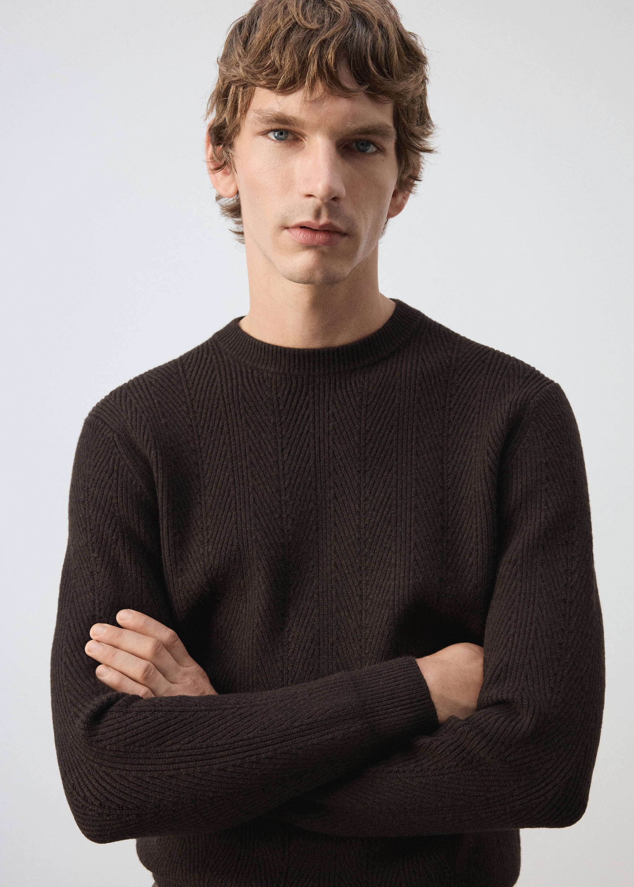Dark brown ribbed crew-neck jumper with chevron knit detail.