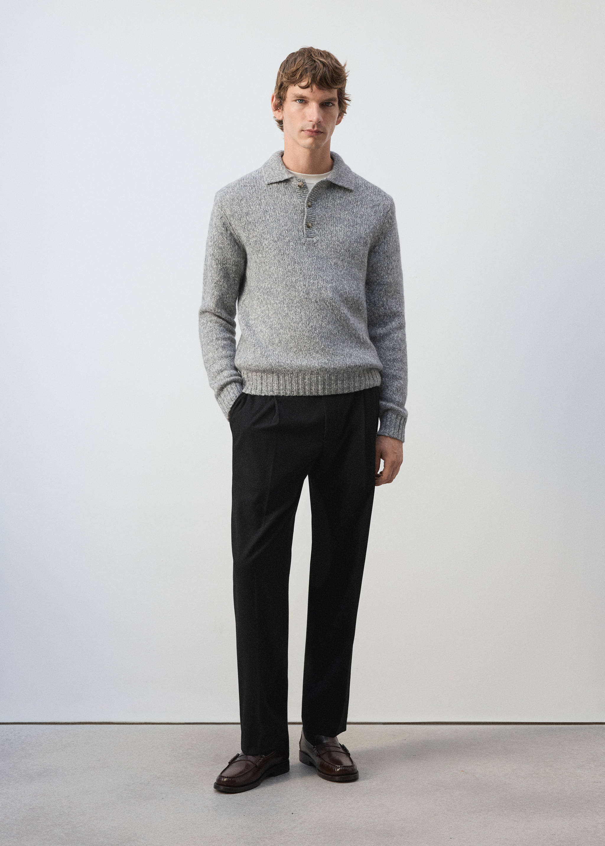 Grey melange knitted polo sweater with a buttoned placket and ribbed trim.