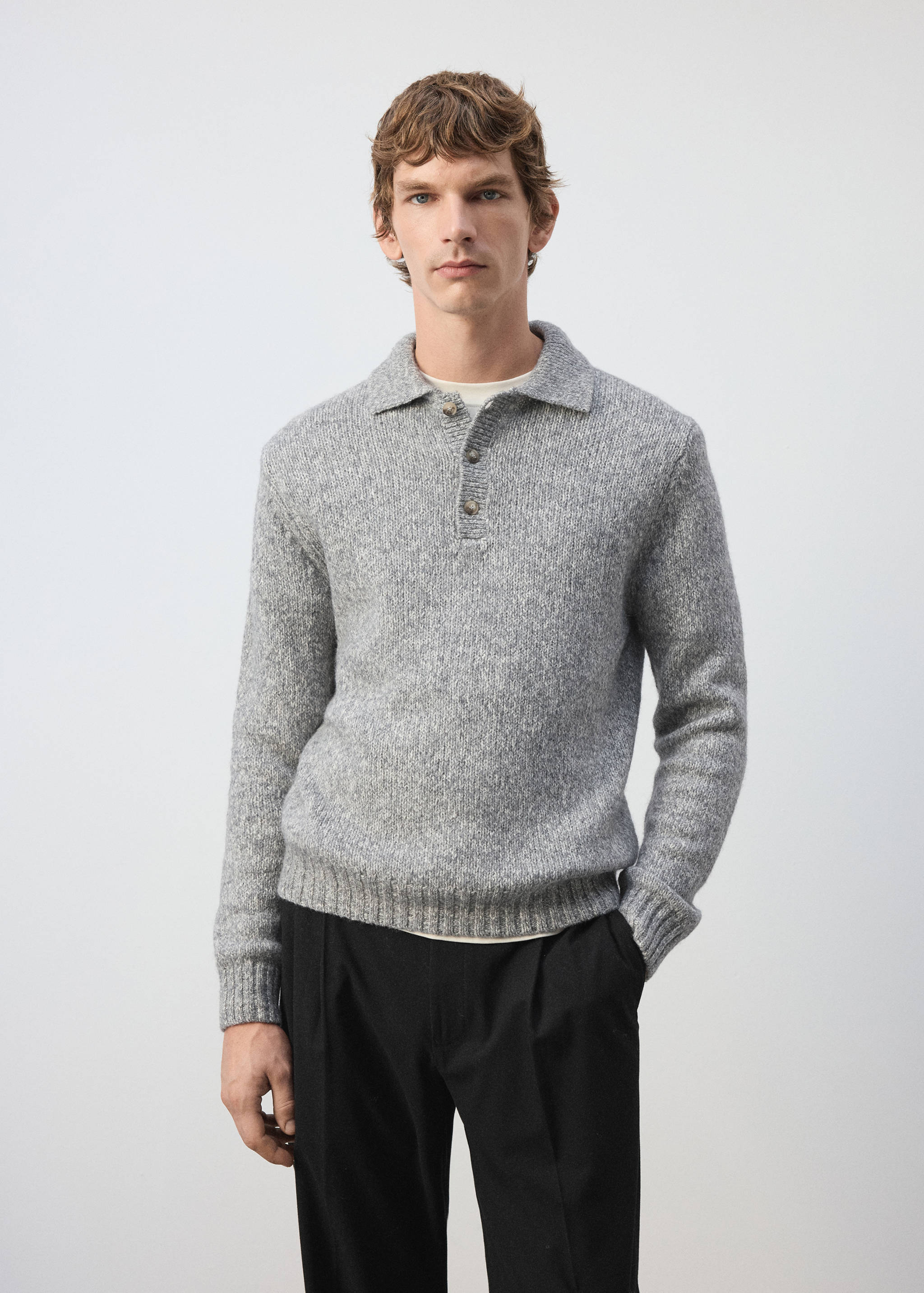 Grey marled knit polo shirt with long sleeves and a buttoned placket.