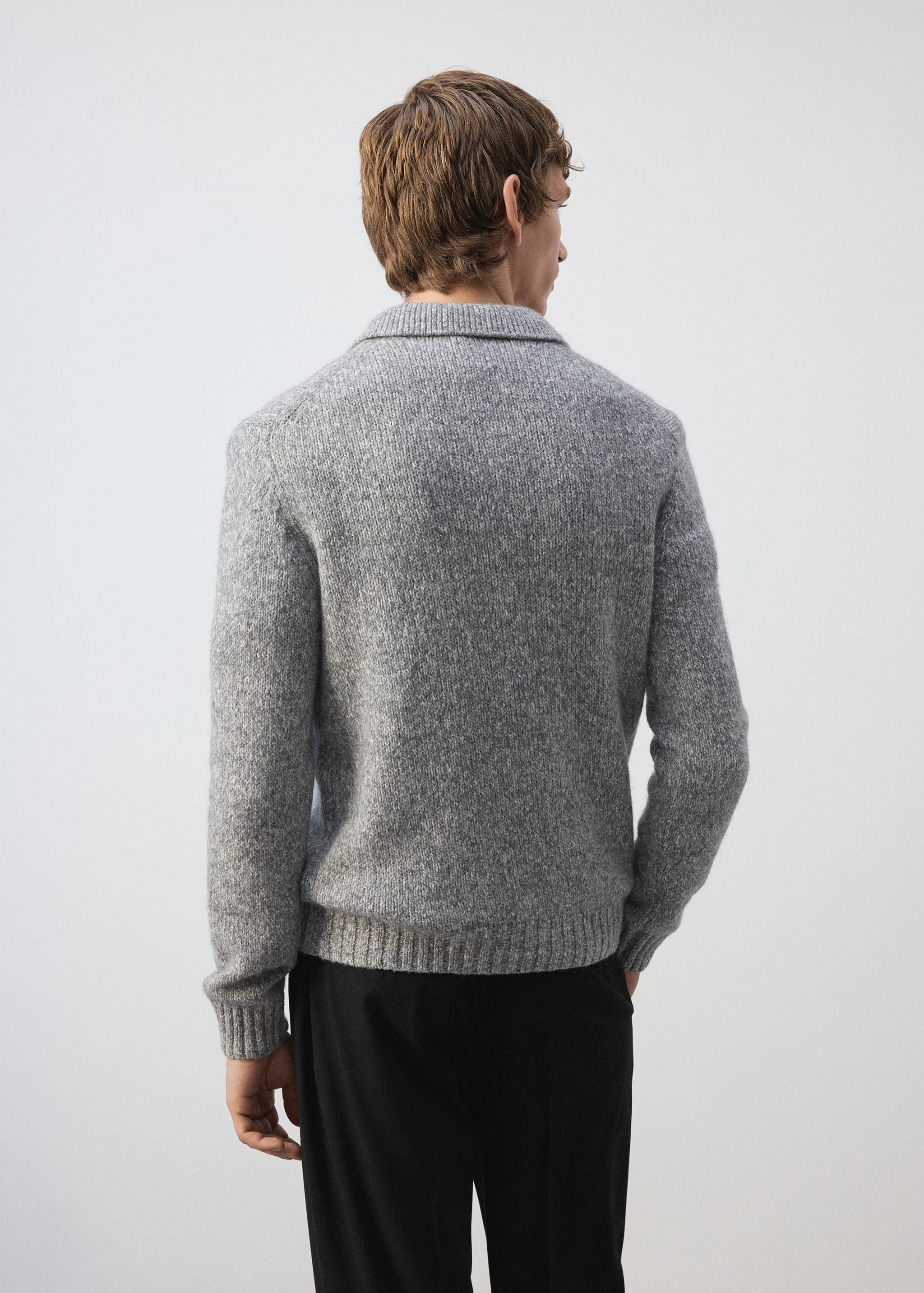 Grey mottled knit polo shirt, back view.