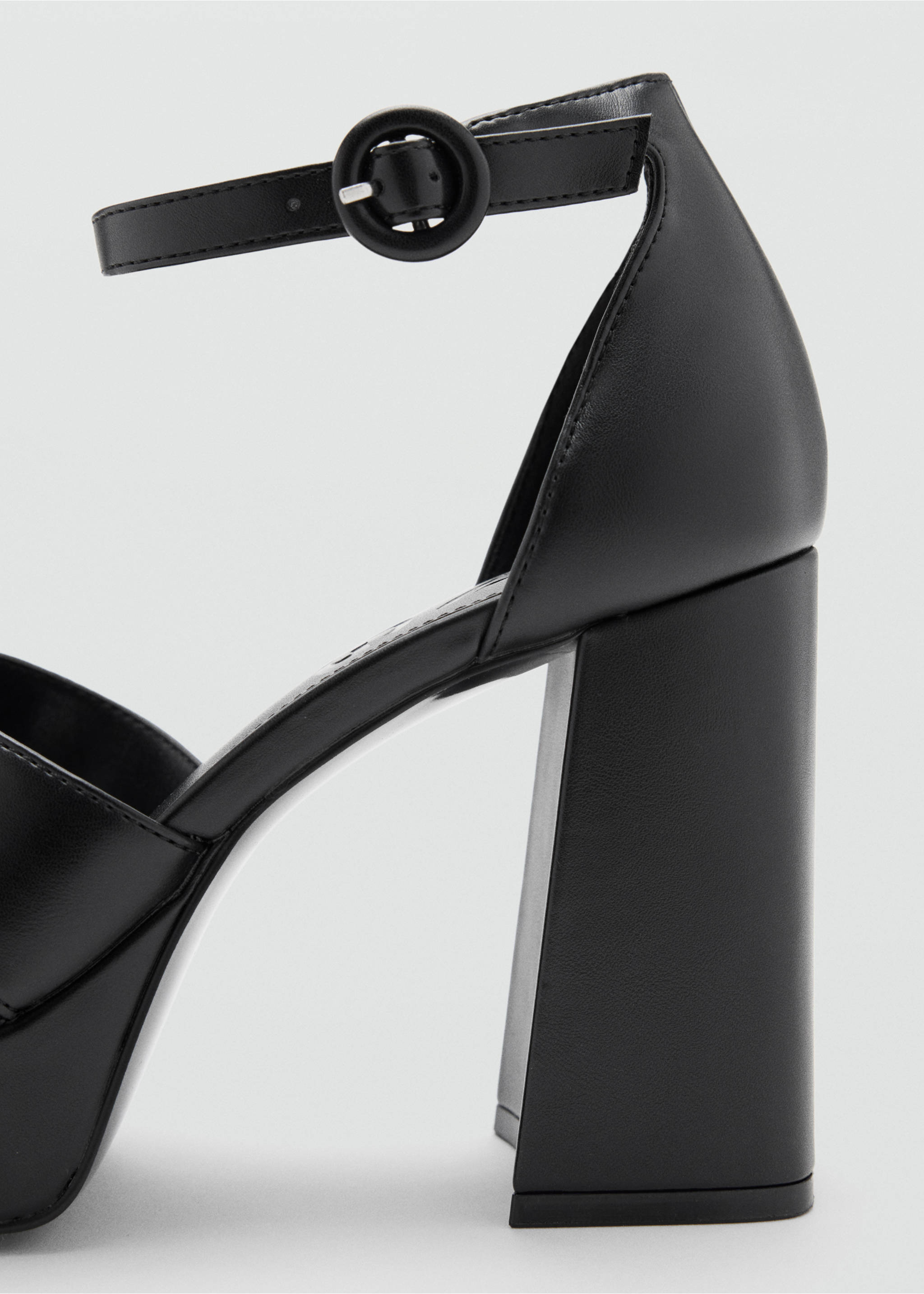 Close-up of a black heeled sandal with a block heel and ankle strap., Black. Ref: 37027926-00.