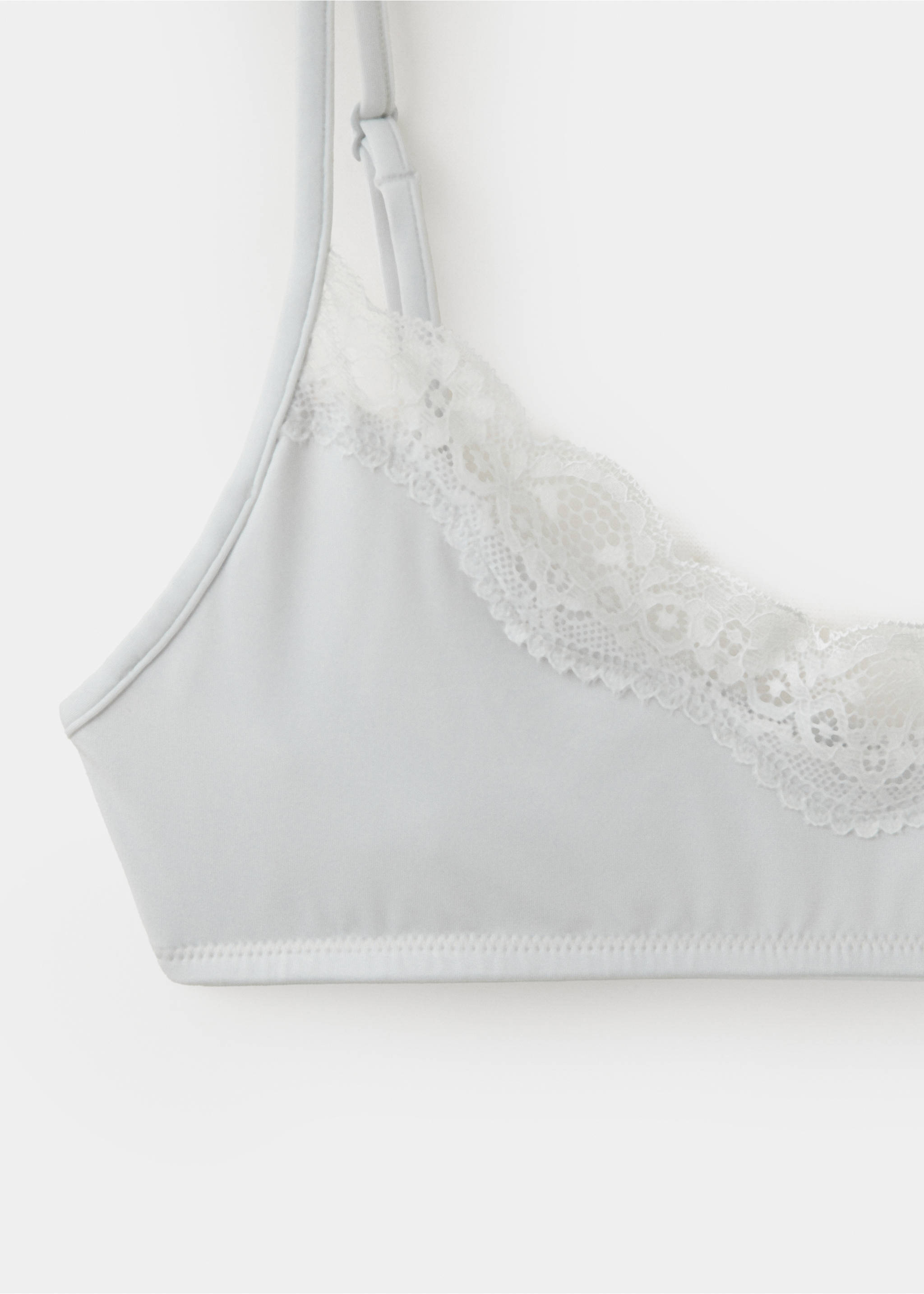 Close-up of a light grey bra with white lace trim and thin straps., Medium Heather Grey. Ref: 37027932-00.