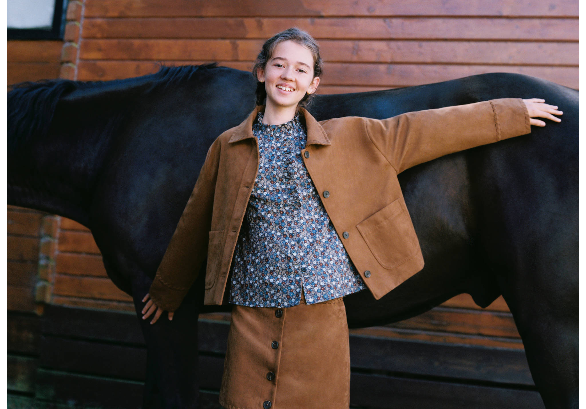 Brown jacket with collar, front buttons and patch pockets.