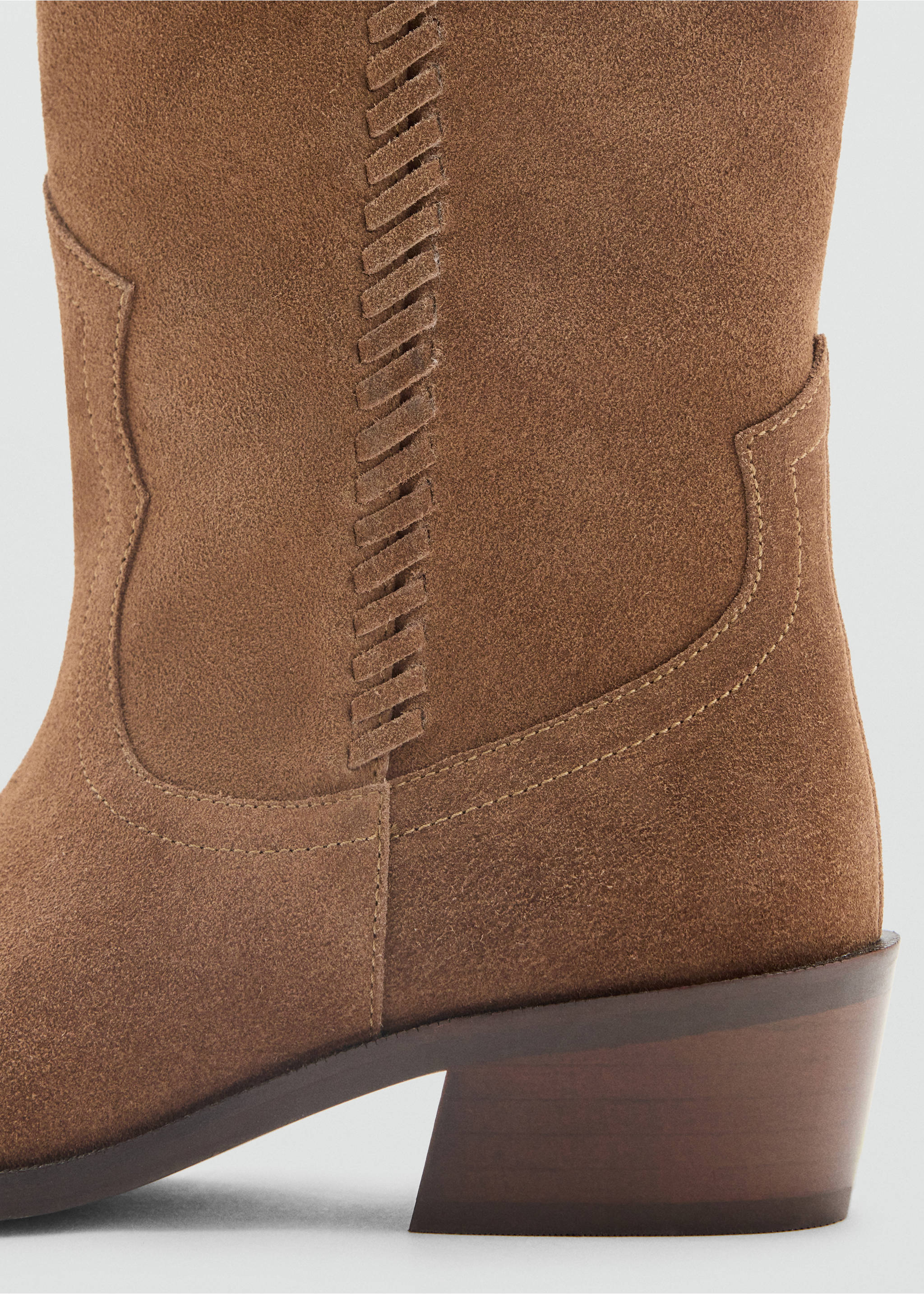 Brown suede boot detail showing whipstitch trim and stacked heel., Medium Brown. Ref: 37027936-00.