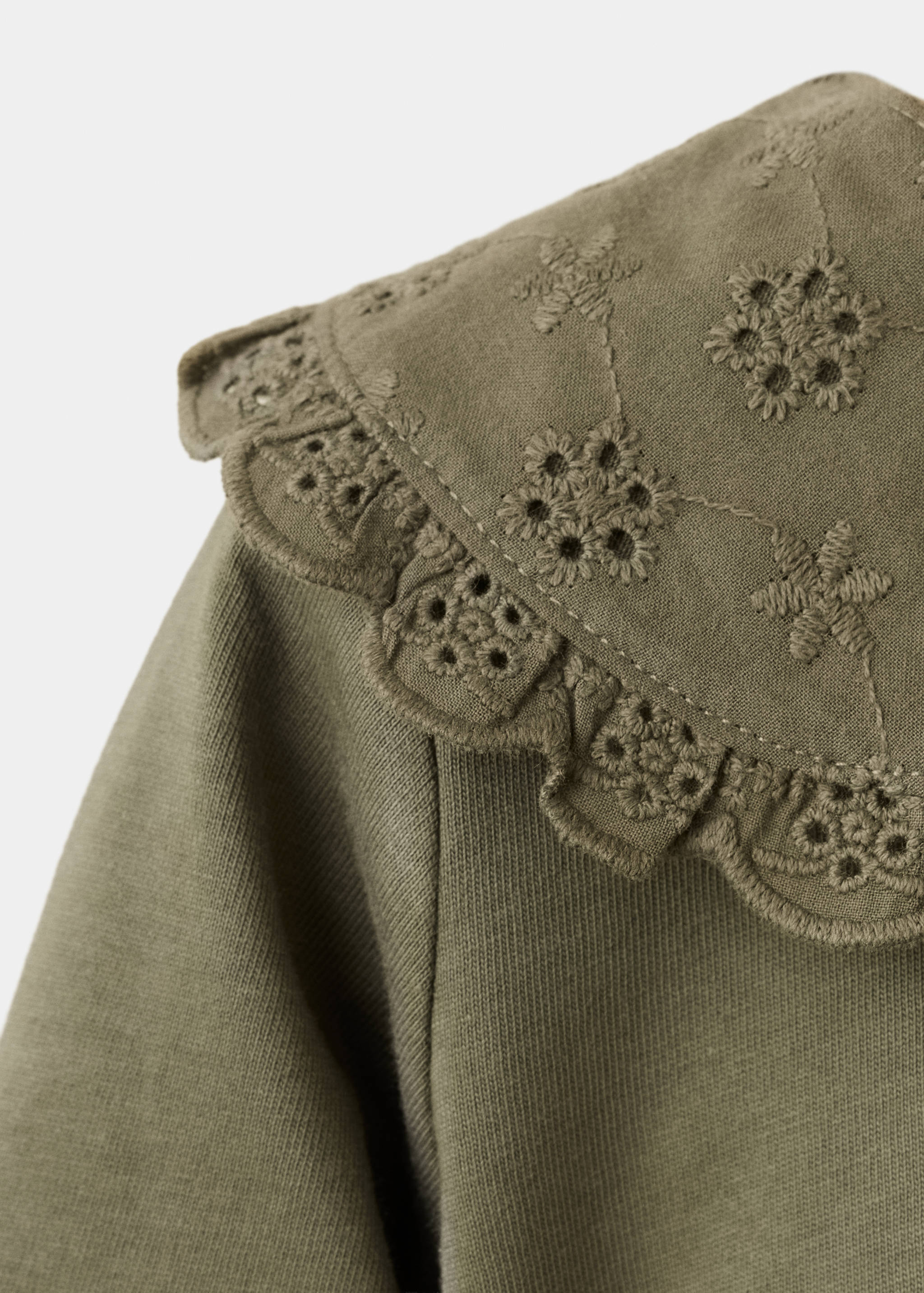 Olive green baby body featuring an embroidered eyelet collar with scalloped trim.