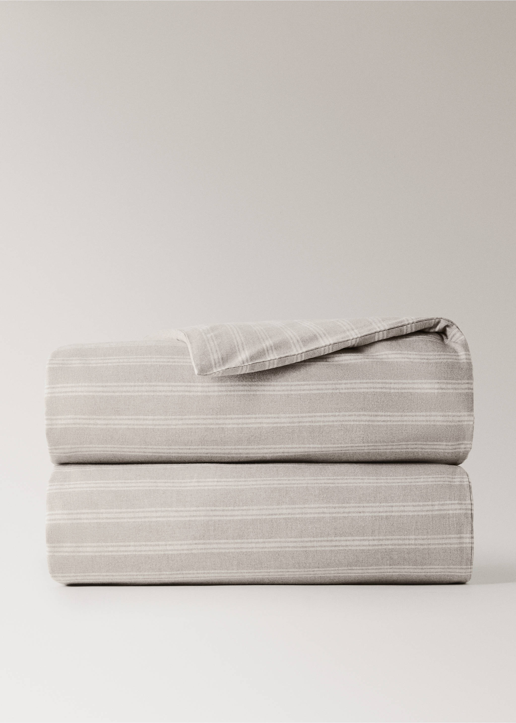 Neutral beige duvet cover featuring a soft white striped pattern, neatly folded., Beige. Ref: 37028268-00.