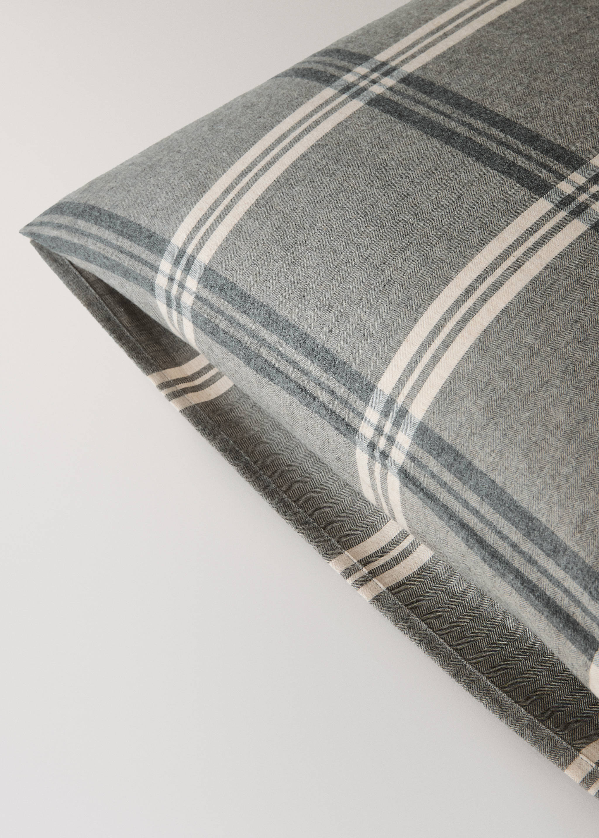 Grey and white plaid pillowcase with an Oxford border detail.